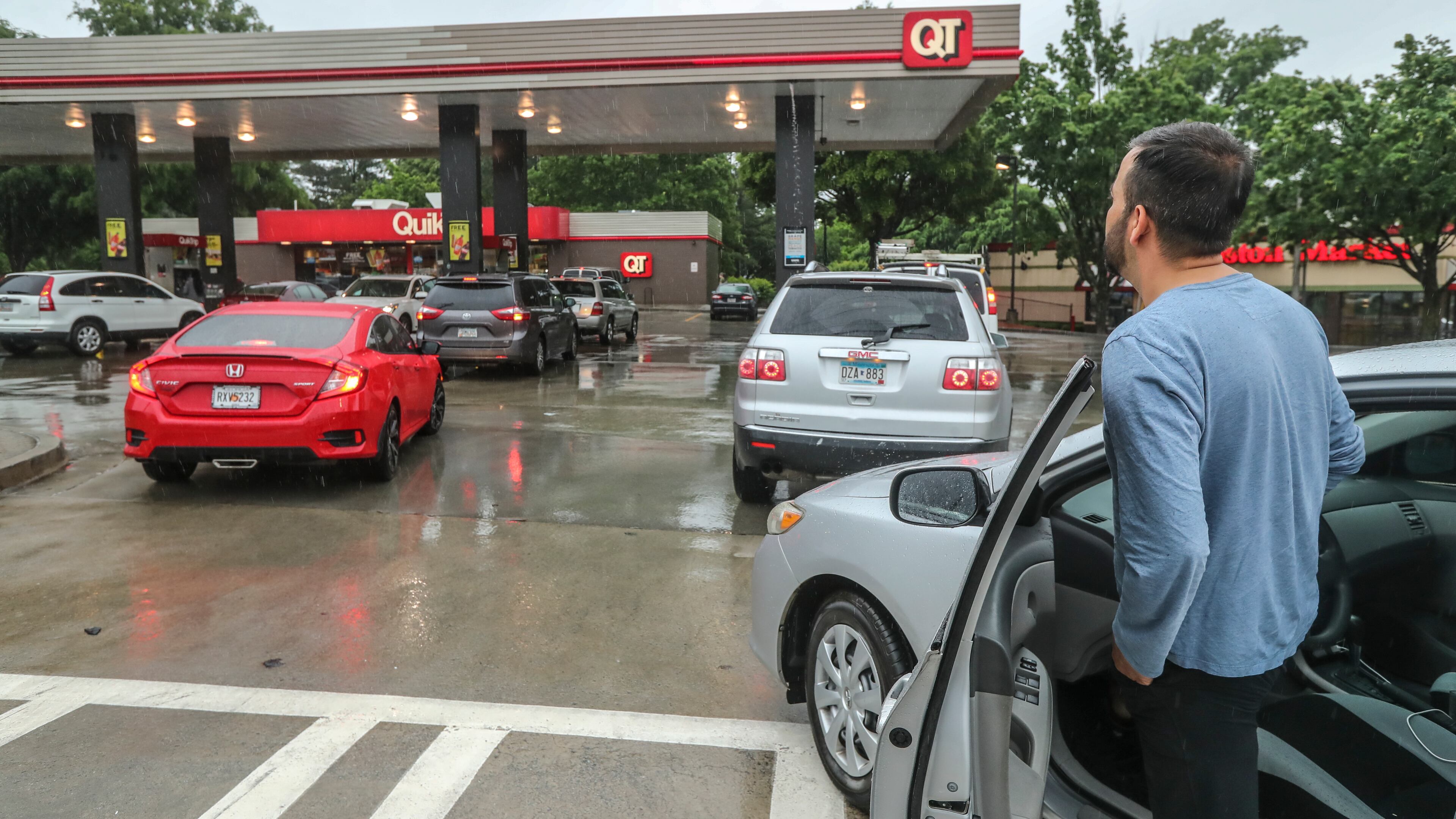 Mirweis Jalalzai moved here from Afghanistan 5 years ago and never saw his former country's gas stations run out of gas before. Lines formed at the QuikTrip located at Briarcliff Road and North Druid Hills in DeKalb County on Wednesday morning, May 12, 2021 as gas continued to flow at the station there until noon and then ran out. (John Spink / John.Spink@ajc.com)