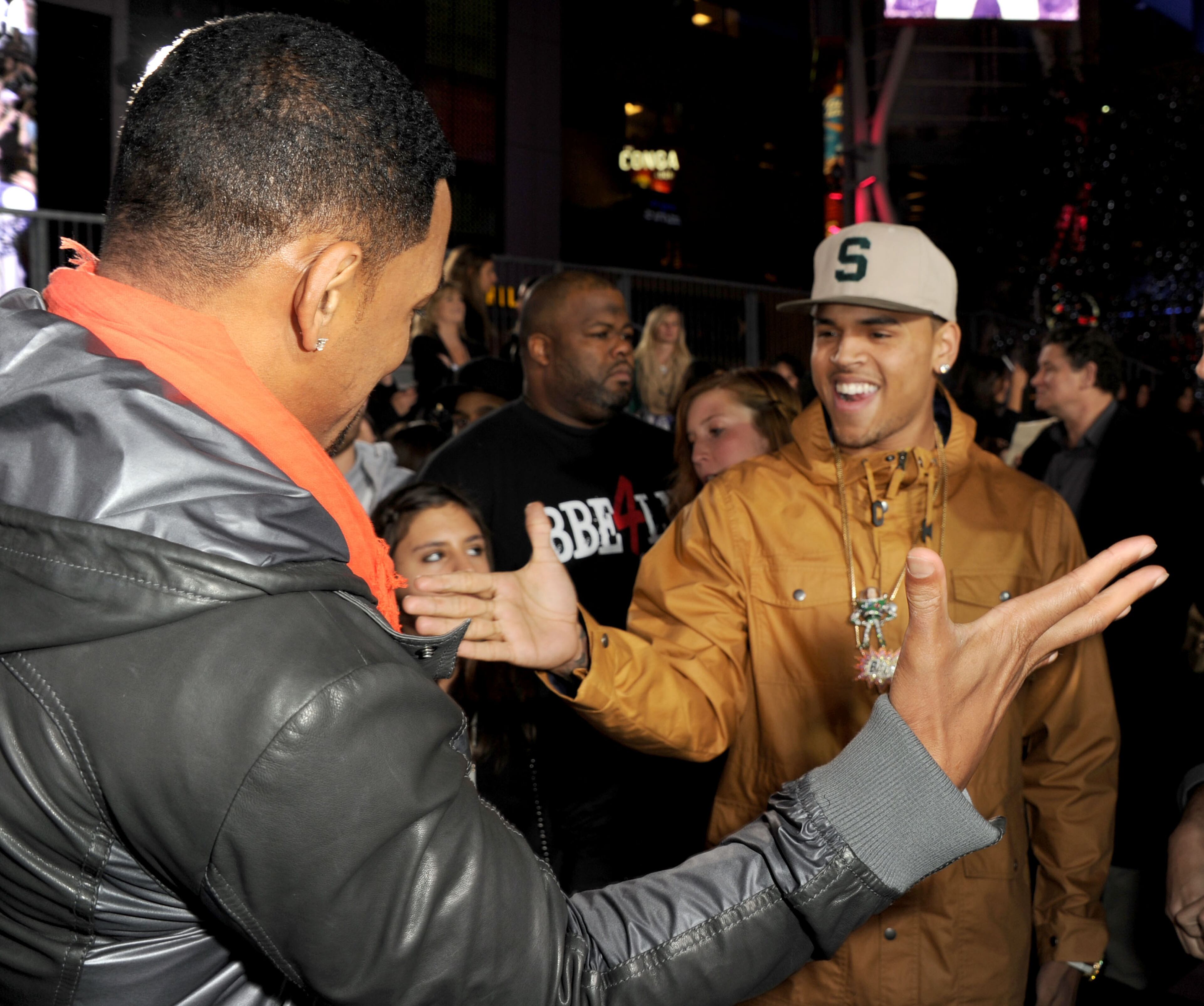 Actor Will Smith (L) and recording artist Chris Brown arrive at the premiere of Paramount Pictures' "Justin Bieber: Never Say Never" held at Nokia Theater L.A. Live on February 8, 2011 in Los Angeles, California. (Photo by Kevin Winter/Getty Images)