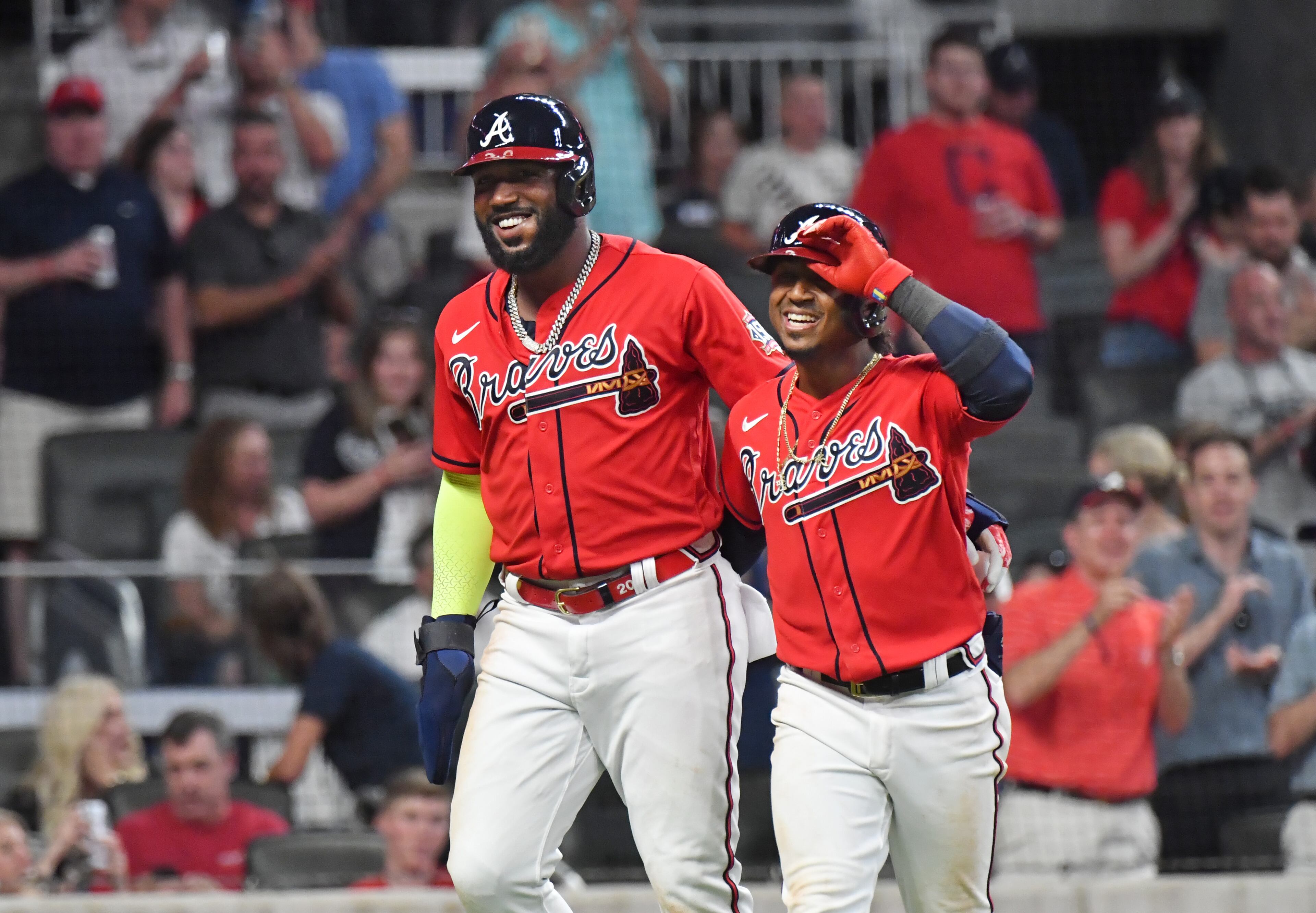 Braves second baseman Ozzie Albies (right) celebrates with Marcell Ozuna (20) after hitting a two-run home run in the 5th inning. (Hyosub Shin / Hyosub.Shin@ajc.com)