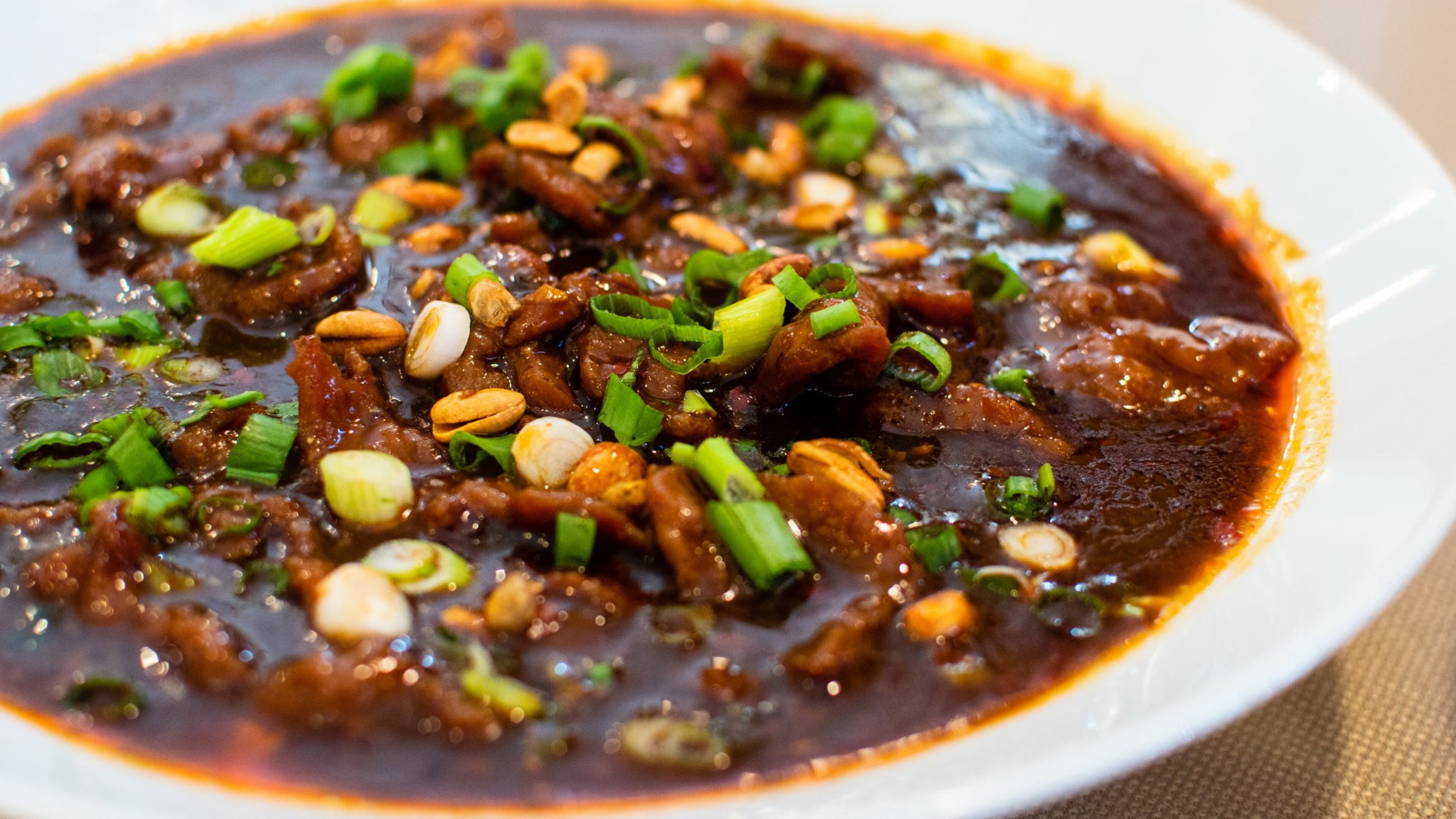 The spicy peppercorn boiled beef/tofu at Masterpiece hits you with a combination punch of spiciness, from hot peppers, chili oil and numbing Sichuan peppercorns. CONTRIBUTED BY HENRI HOLLIS