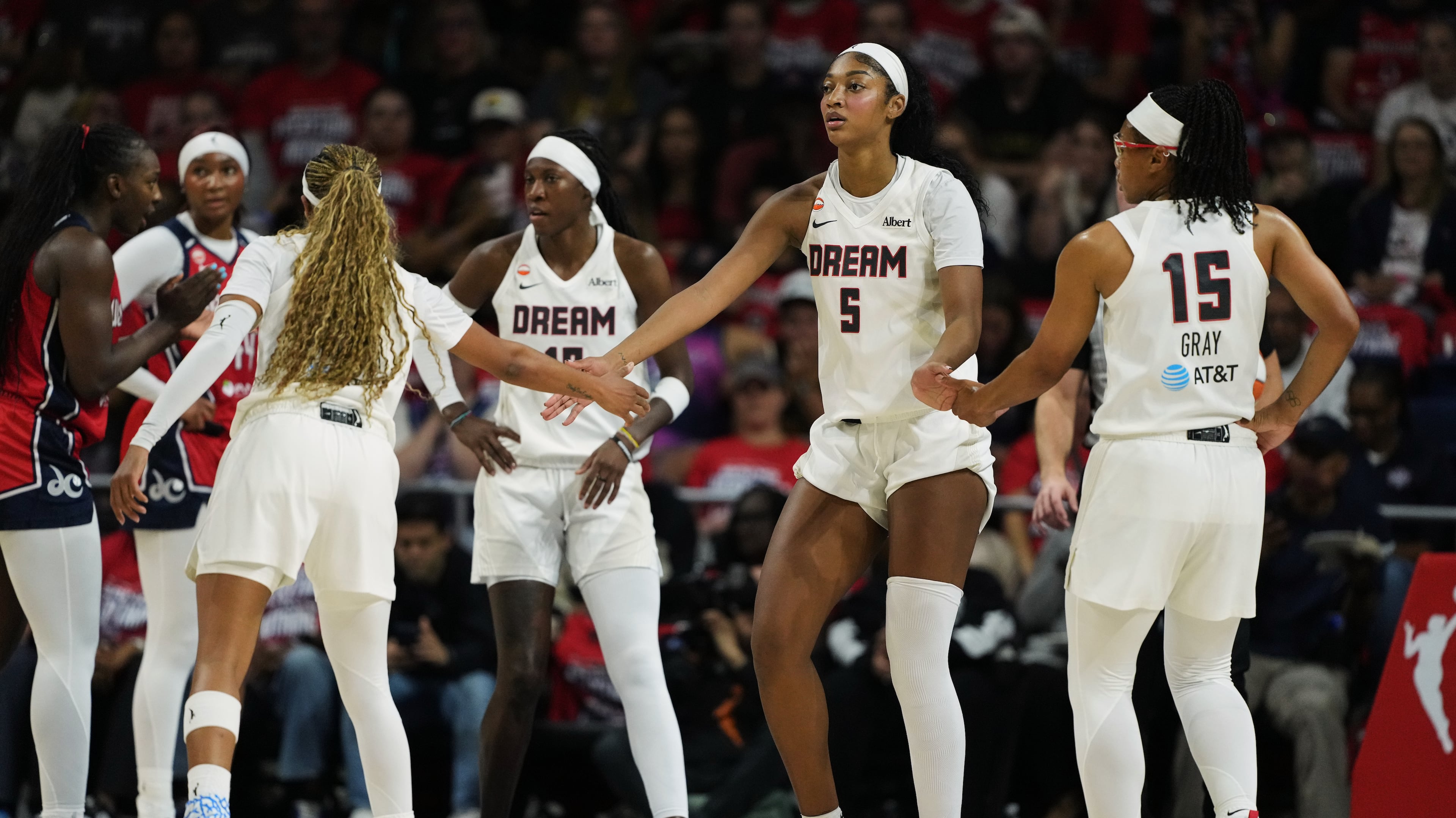 Atlanta Dream forward Angel Reese (5) celebrates with teammates after being fouled against during the first half in Game 2 of a WNBA basketball first-round playoff series against the Washington Mystics, Wednesday, Sept. 30, 2026, in Washington. (AP Photo/Stephanie Scarbrough)