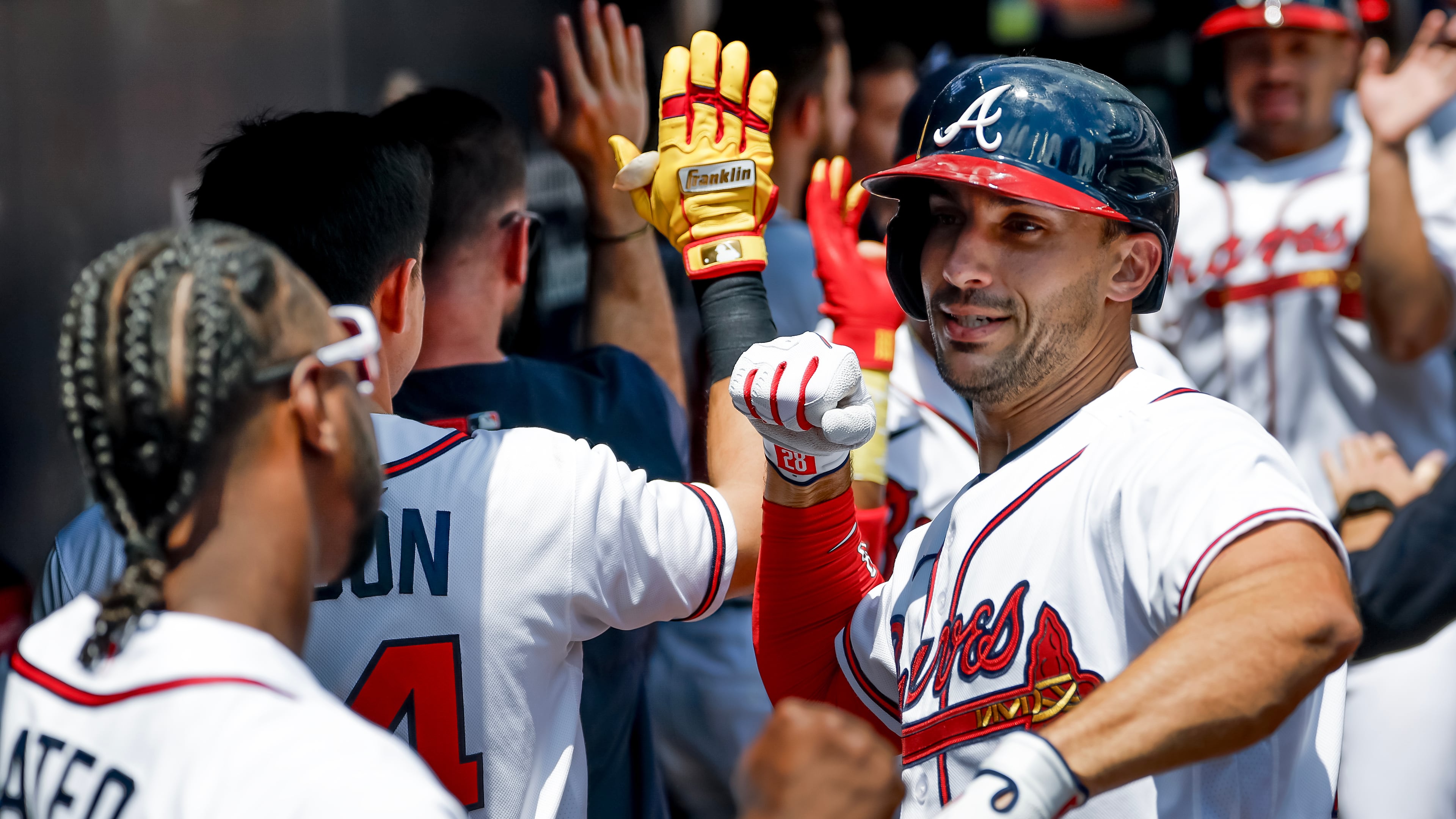 Atlanta Braves' Matt Olson, right, celebrates in the dugout with Jorge Mateo, left, after hitting a three-run home run against the Philadelphia Phillies during the first inning of a baseball game, Sunday, April 26, 2026, in Atlanta. (AP Photo/Erik S. Lesser)