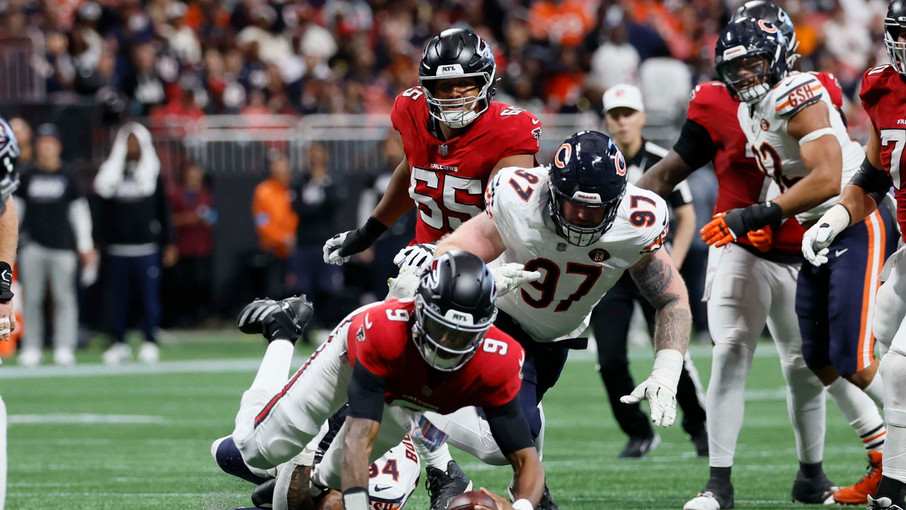 Atlanta Falcons quarterback Michael Penix Jr. is sacked by Chicago Bears defensive end Austin Booker in the second half of an NFL game at Mercedes-Benz Stadium in Atlanta on Sunday, Oct. 18, 2026. (Miguel Martinez/AJC)