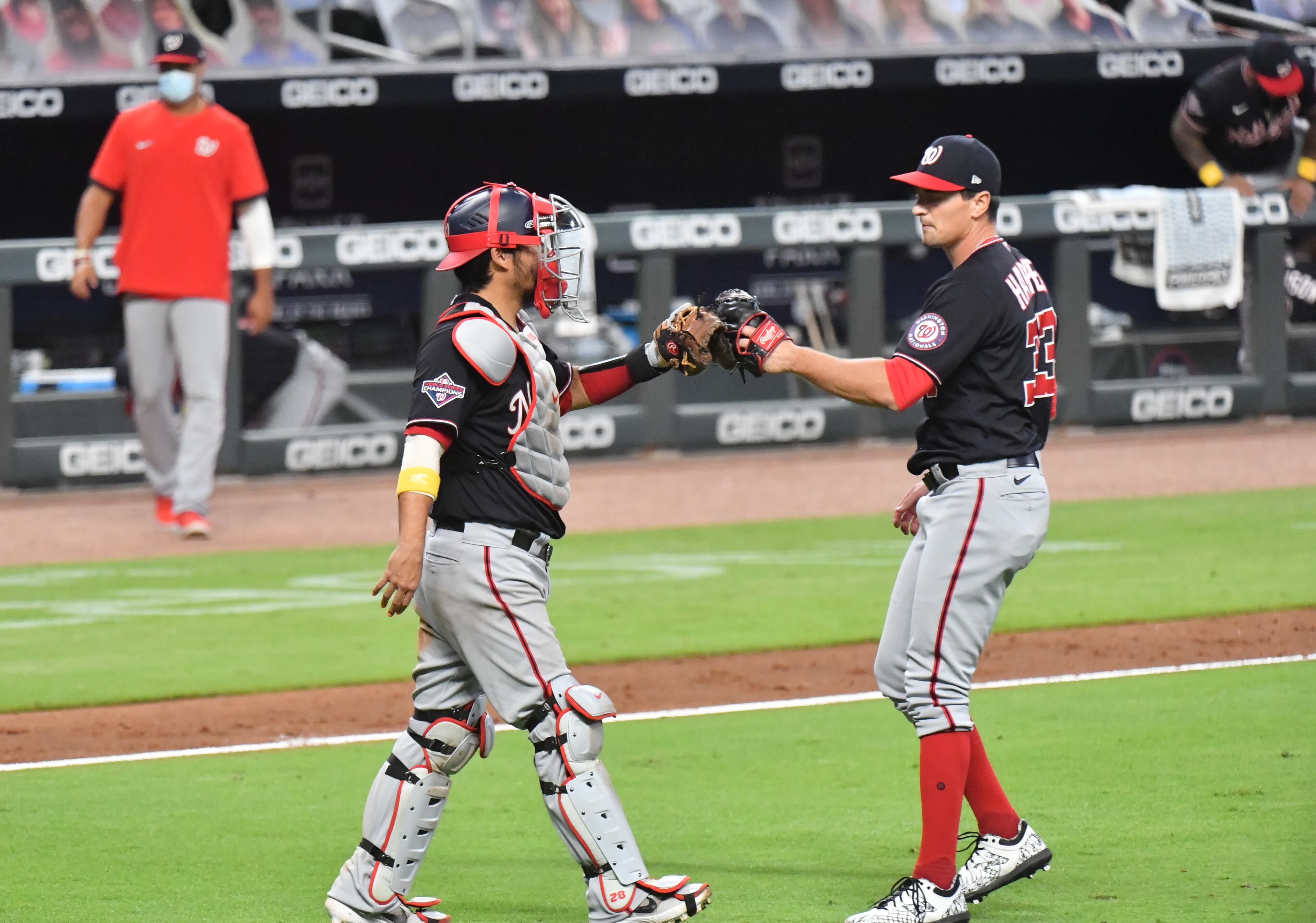 Washington Nationals catcher Kurt Suzuki (28) and Washington Nationals relief pitcher Ryne Harper (33) celebrate their victory in a MLB baseball game at Truist Park on Saturday, September 5, 2020. Washington Nationals won 10-4 over the Atlanta Braves. (Hyosub Shin / Hyosub.Shin@ajc.com)