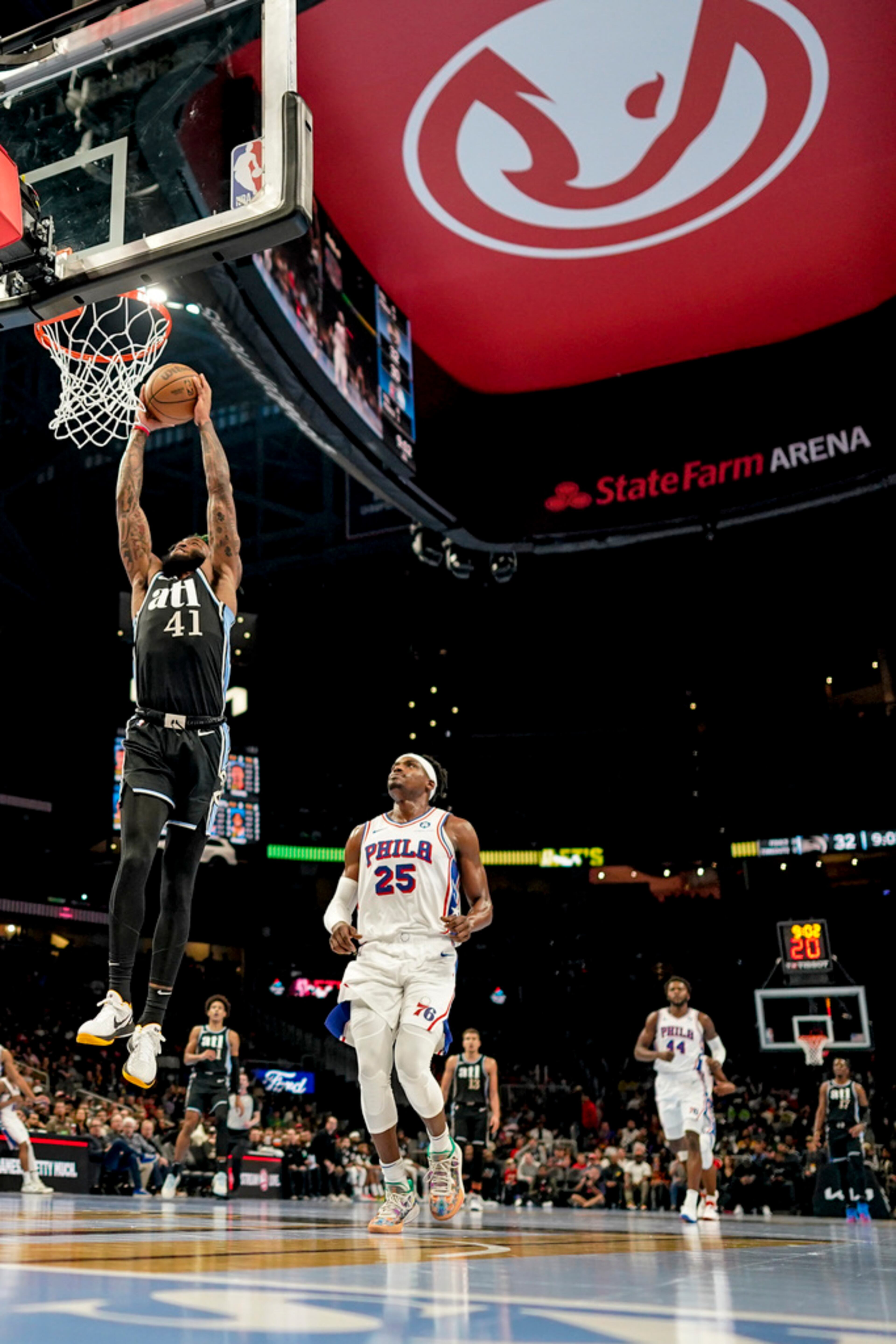 Atlanta Hawks forward Saddiq Bey (41) heads to the hoop against Philadelphia 76ers forward Danuel House Jr. (25) during the first half of an In-Season Tournament NBA basketball game, Friday, Nov. 17, 2023, in Atlanta. (AP Photo/Mike Stewart)