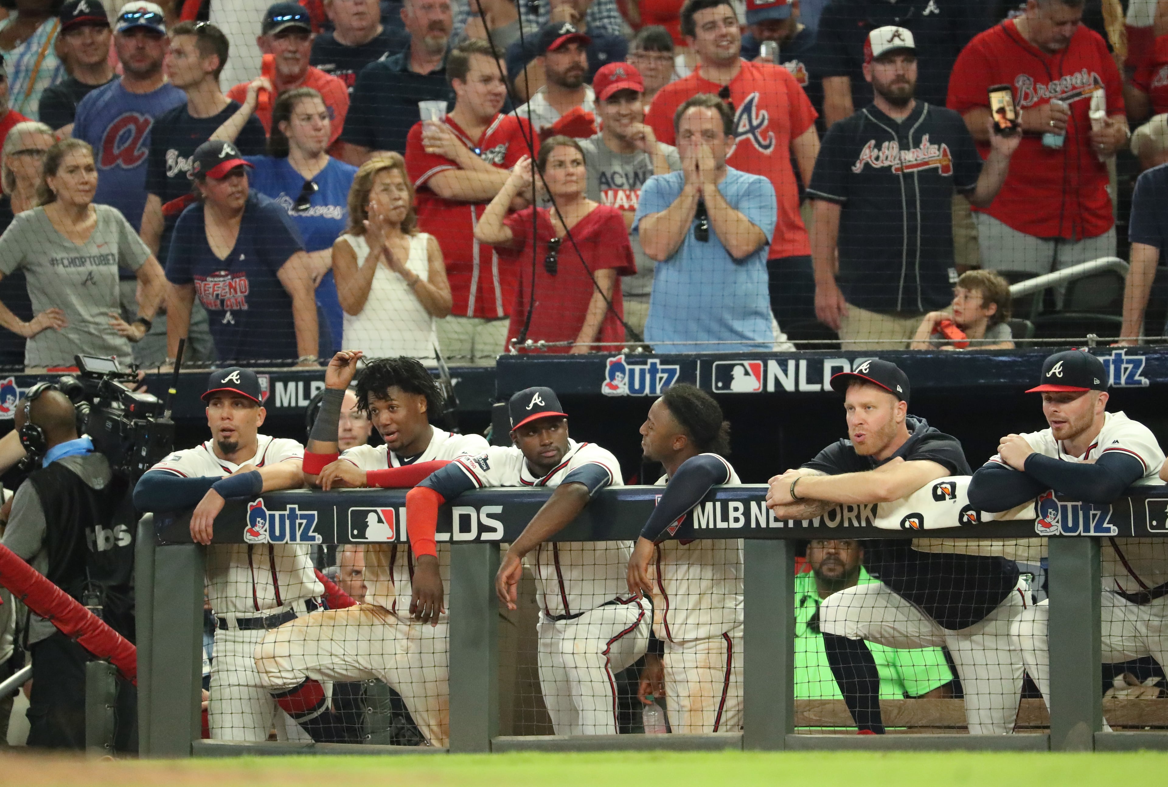 Braves players react during their loss to the St. Louis Cardinals in the ninth inning. (JASON GETZ/SPECIAL TO THE AJC)
