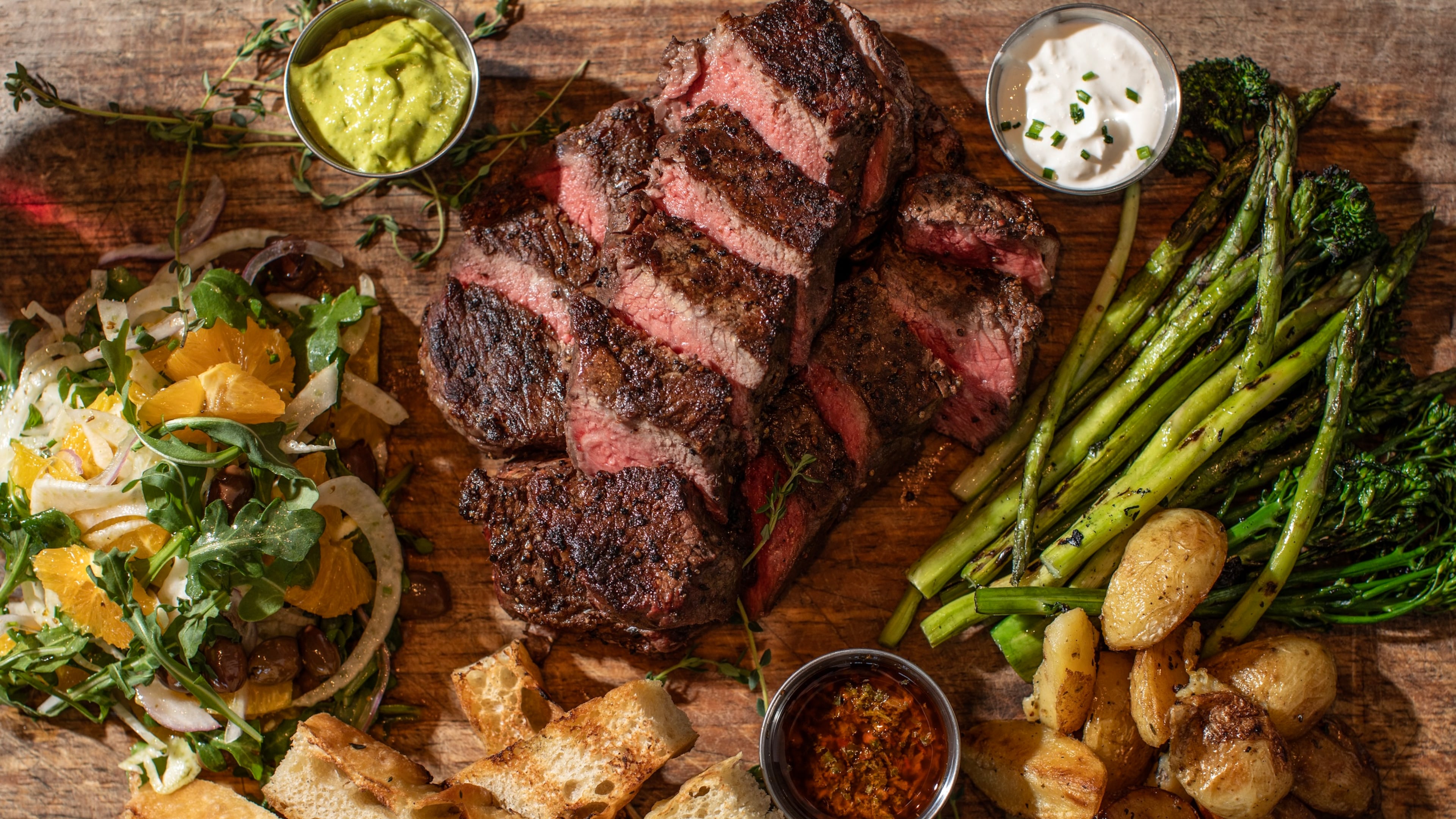 A steak with sides from Enzo Steakhouse & Bar in Fayetteville. (Heidi Harris/Courtesy of Enzo Steakhouse & Bar)