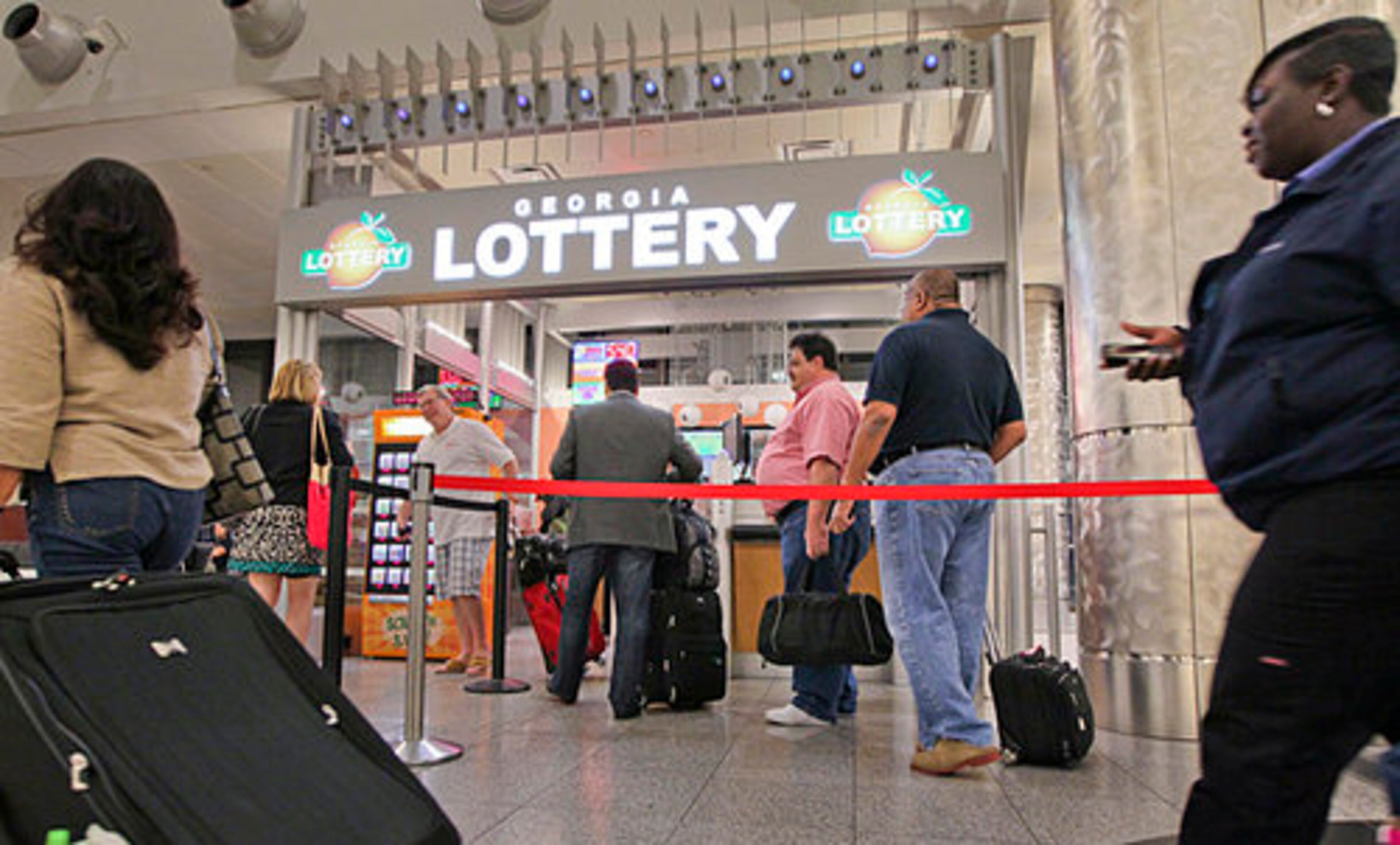 Patrons at the Georgia Lottery Store at Hartsfield-Jackson International Airport lined up to buy tickets Friday morning in hopes of winning the Mega Millions jackpot, worth more than a half-billion dollars.
