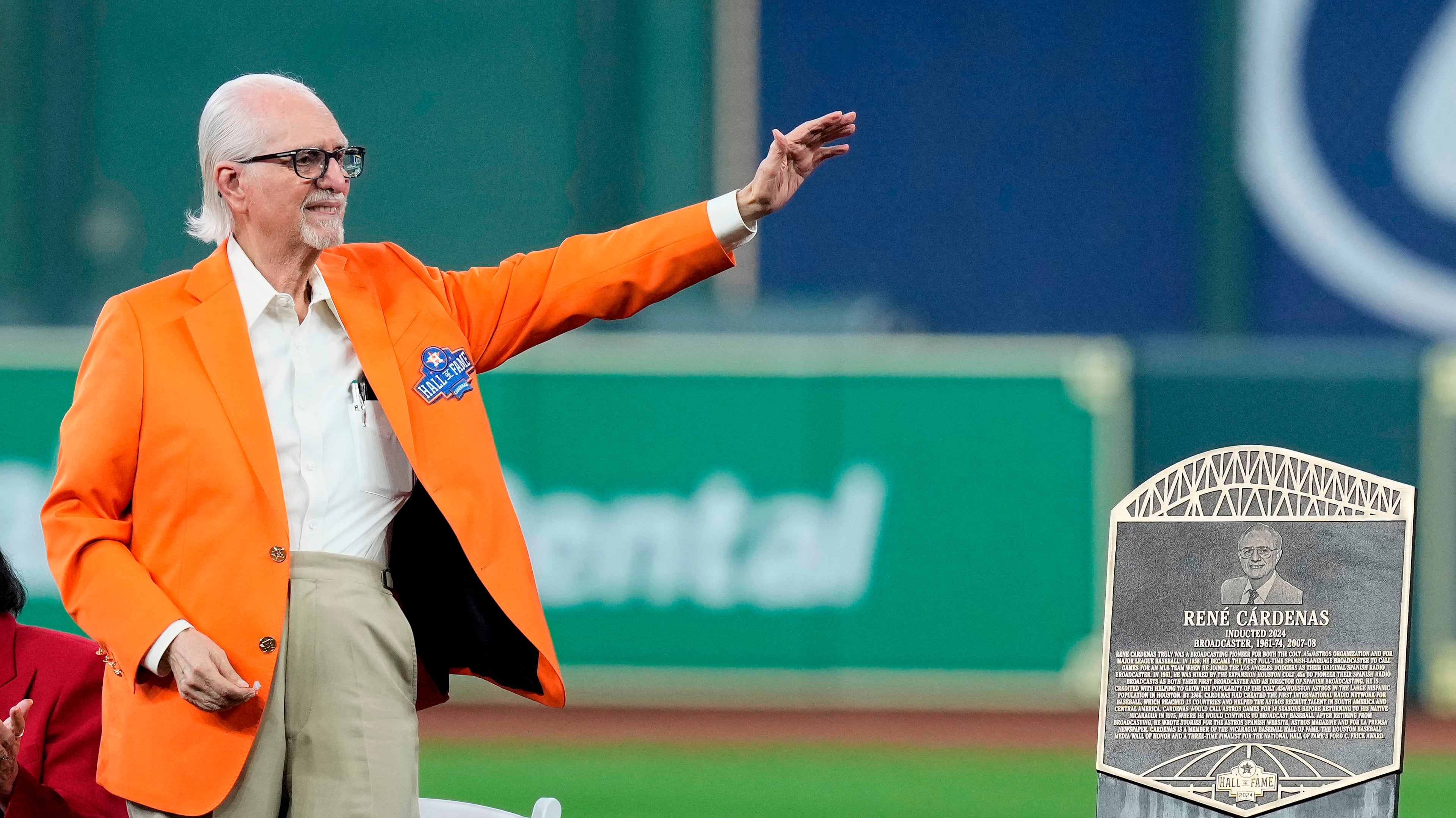 FILE - Longtime Spanish radio broadcaster René Cárdenas waves to the crowd as he is inducted into the Houston Astros Hall of Fame Saturday, Aug. 17, 2024, in Houston. (AP Photo/Kevin M. Cox, File)