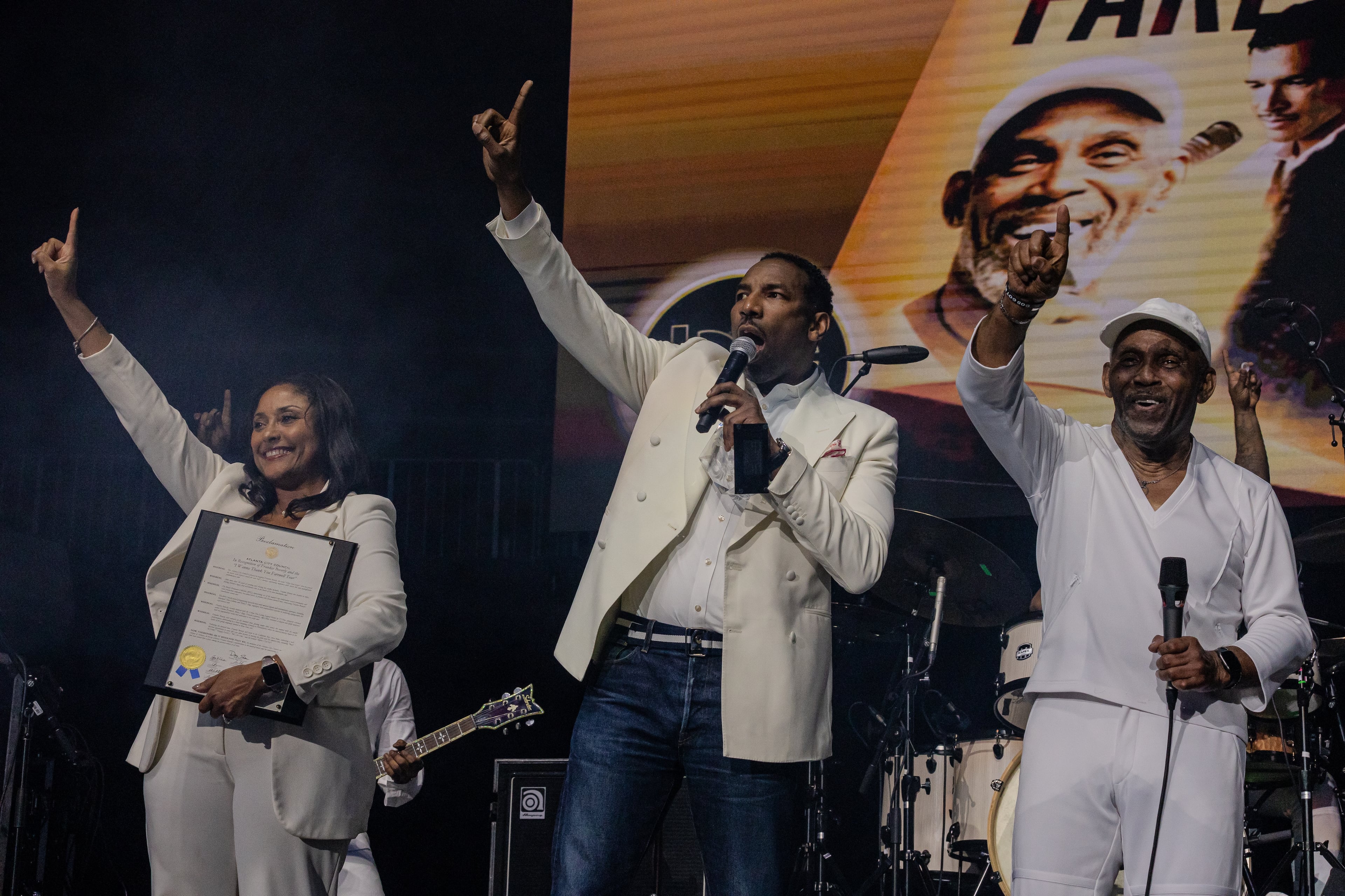 Atlanta City Councilmember Marci Overstreet and Atlanta Mayor Andre Dickens give a special proclamation to Frankie Beverly during Frankie Beverly & Maze’s farewell tour at State Farm Arena in Atlanta on March 22, 2024. (Kymani Culmer for the Atlanta Journal-Constitution)