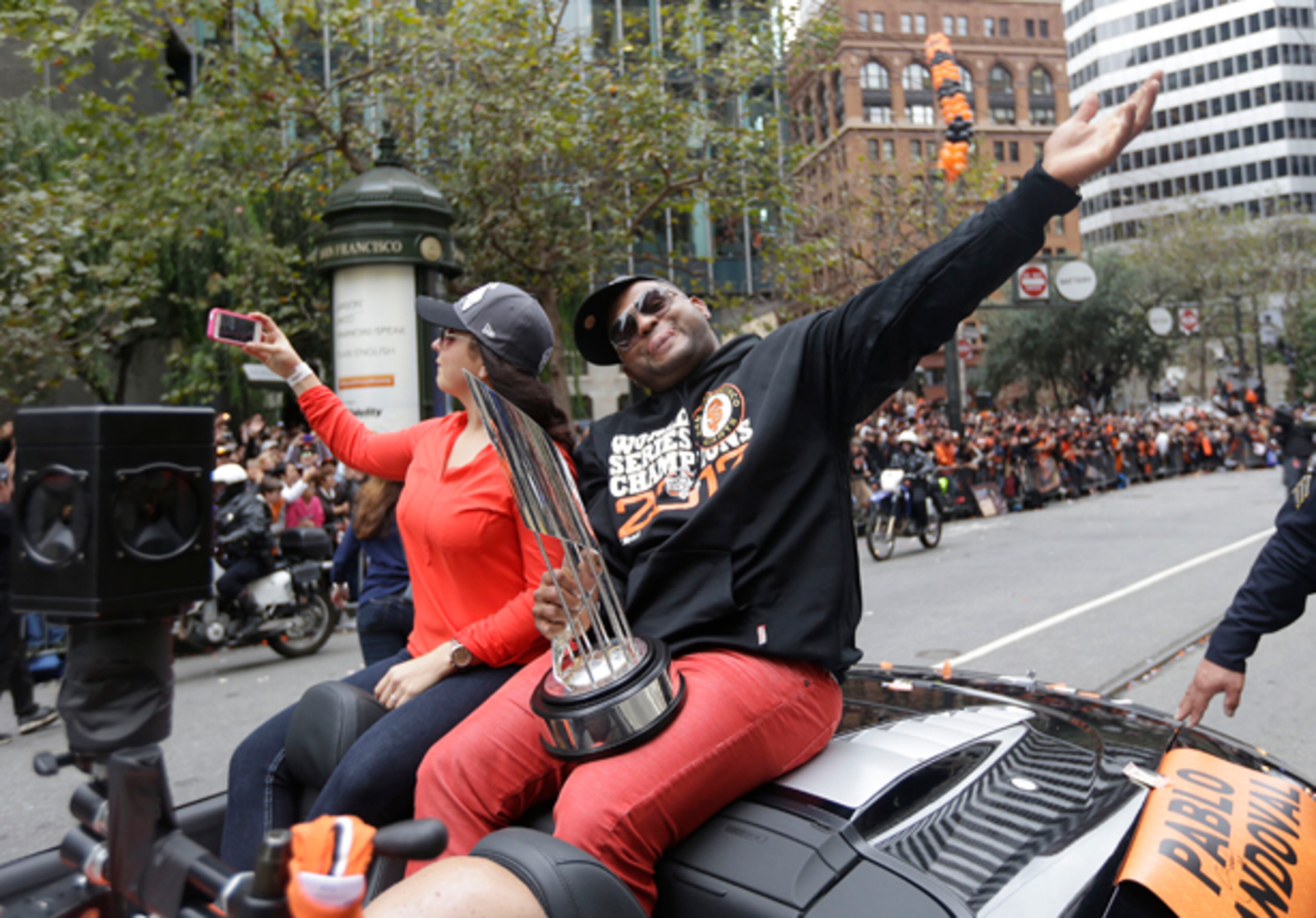 San Francisco Giants third baseman and World Series MVP Pablo Sandoval waves while riding in the baseball team's World Series victory parade on Market Street in San Francisco, Wednesday, Oct. 31, 2012. (AP Photo/Marcio J. Sanchez)