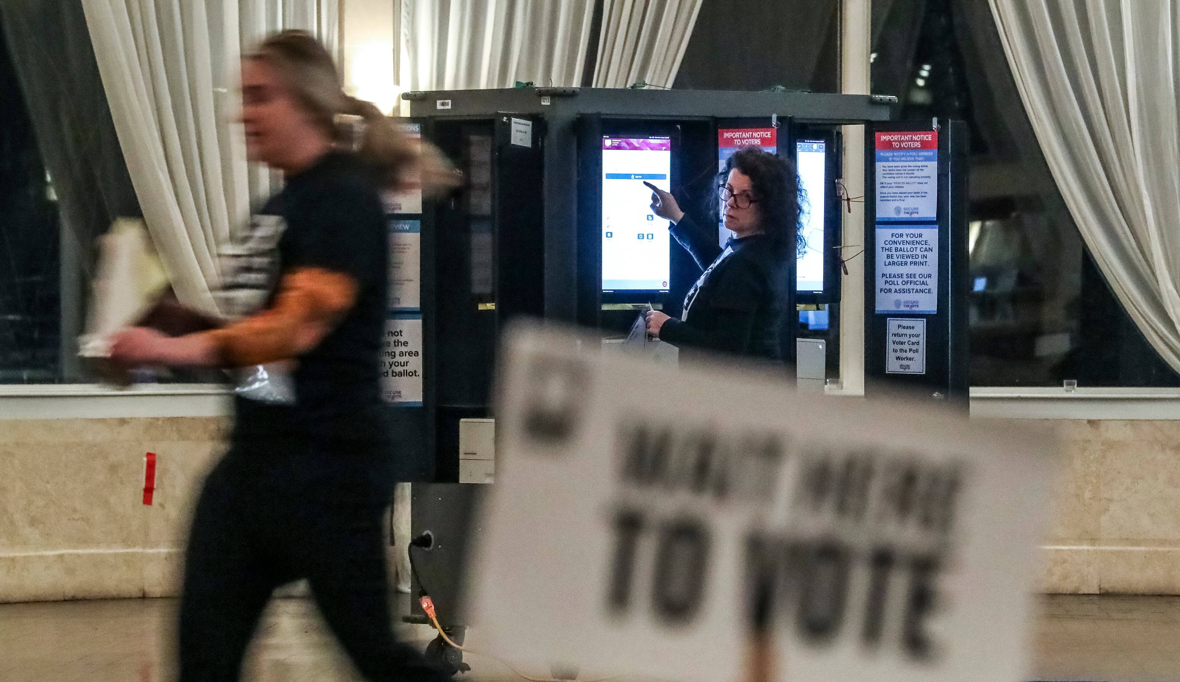The secretary of state’s office says touchscreens, called ballot-marking devices, should be positioned so that the screens face walls rather than voters waiting in line. (John Spink / John.Spink@ajc.com)