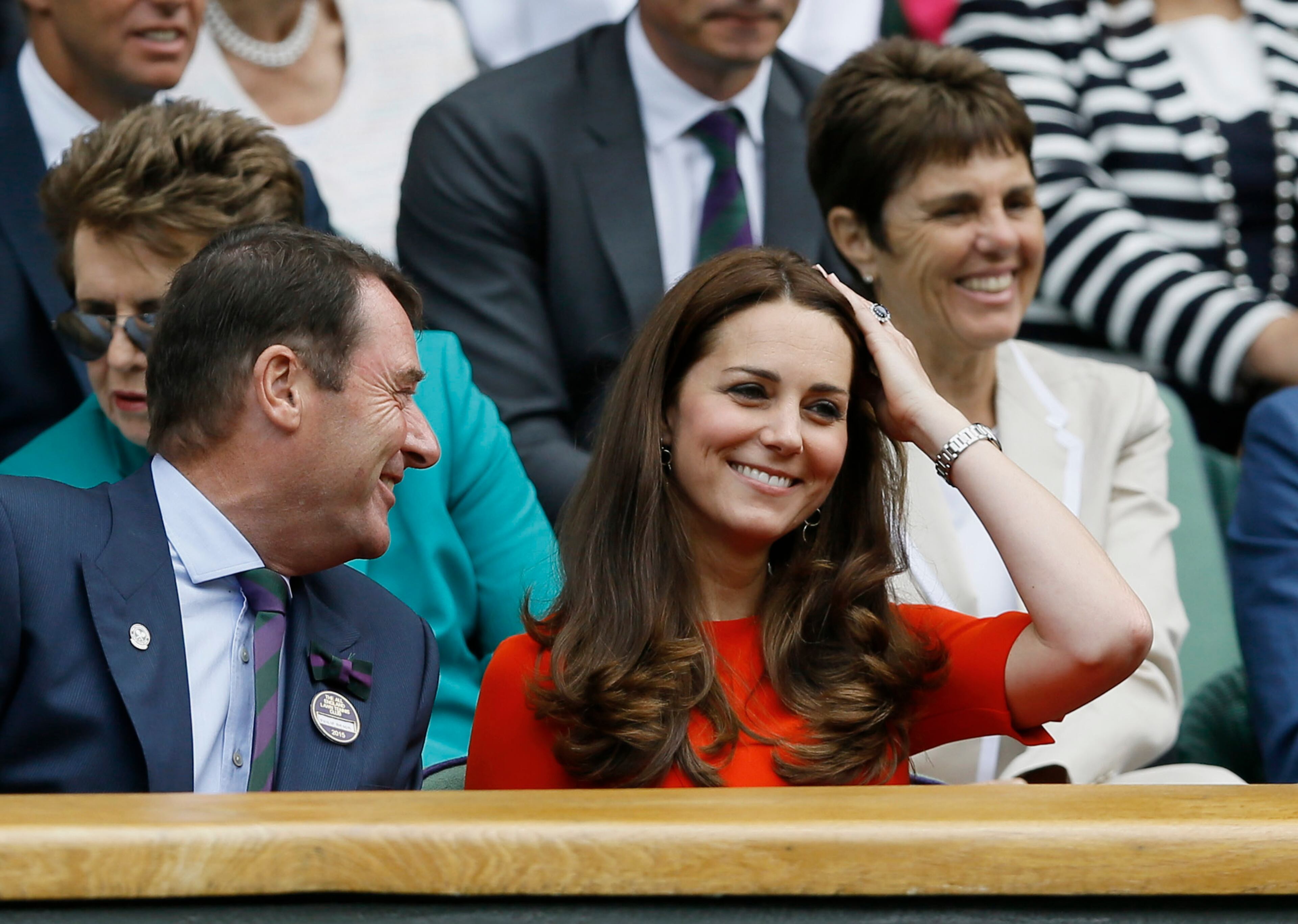 Kate, the Duchess of Cambridge, right, sits next to All England Lawn Tennis Club Chairman Philip Brook in the Royal Box on Centre Court, at the All England Lawn Tennis Championships in Wimbledon, London, Wednesday July 8, 2015. (AP Photo/Kirsty Wigglesworth)