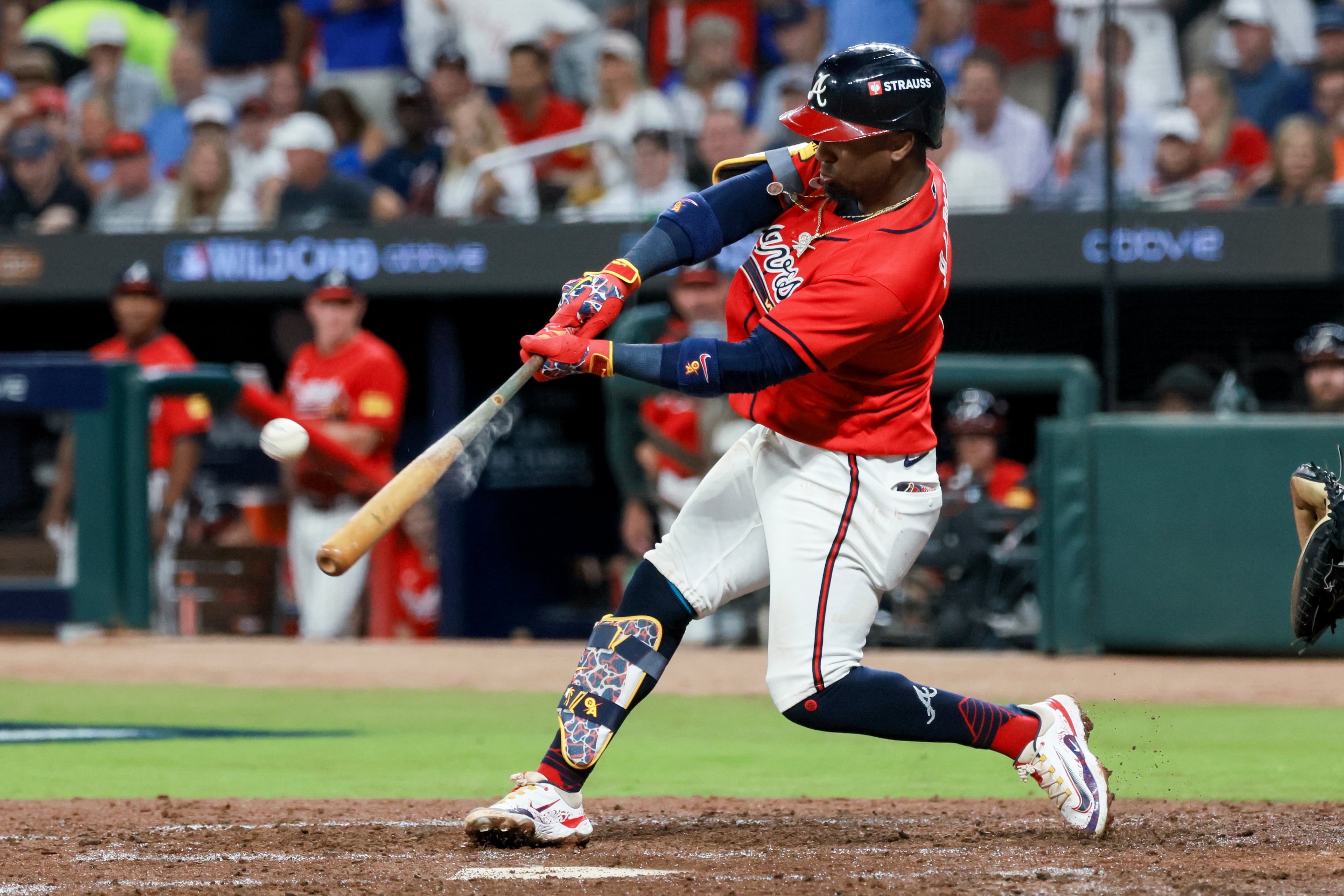 Braves second baseman Ozzie Albies hits a two-run home run against the Phillies during Game 3 of their NL Wild Card Series on Thursday, Oct. 1, 2026, in Atlanta. (Jason Getz/AJC)