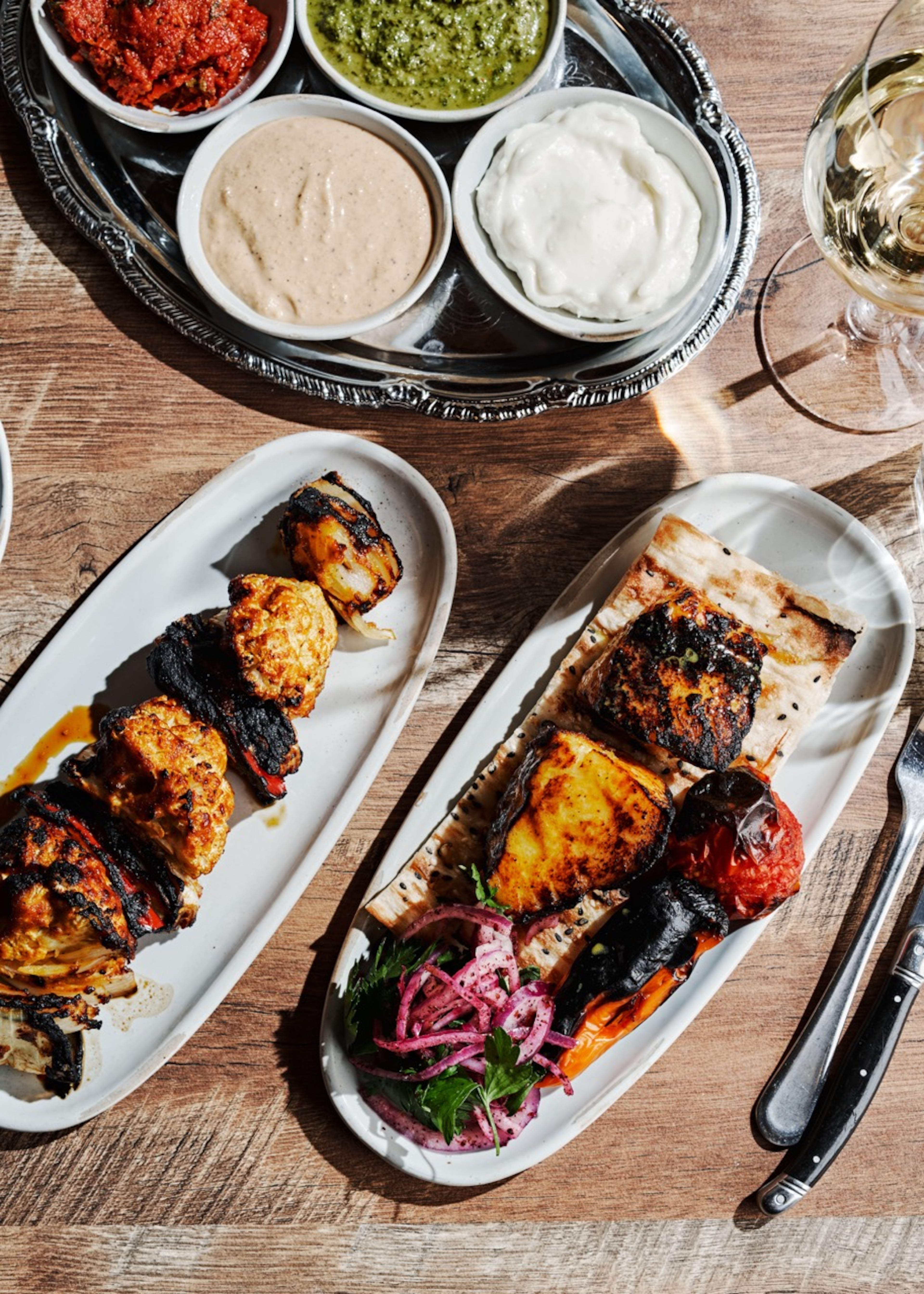 The main dishes, such as these kabobs, show off the kitchen’s grilling talent at Delbar. Courtesy of Delbar/Andrew Thomas Lee