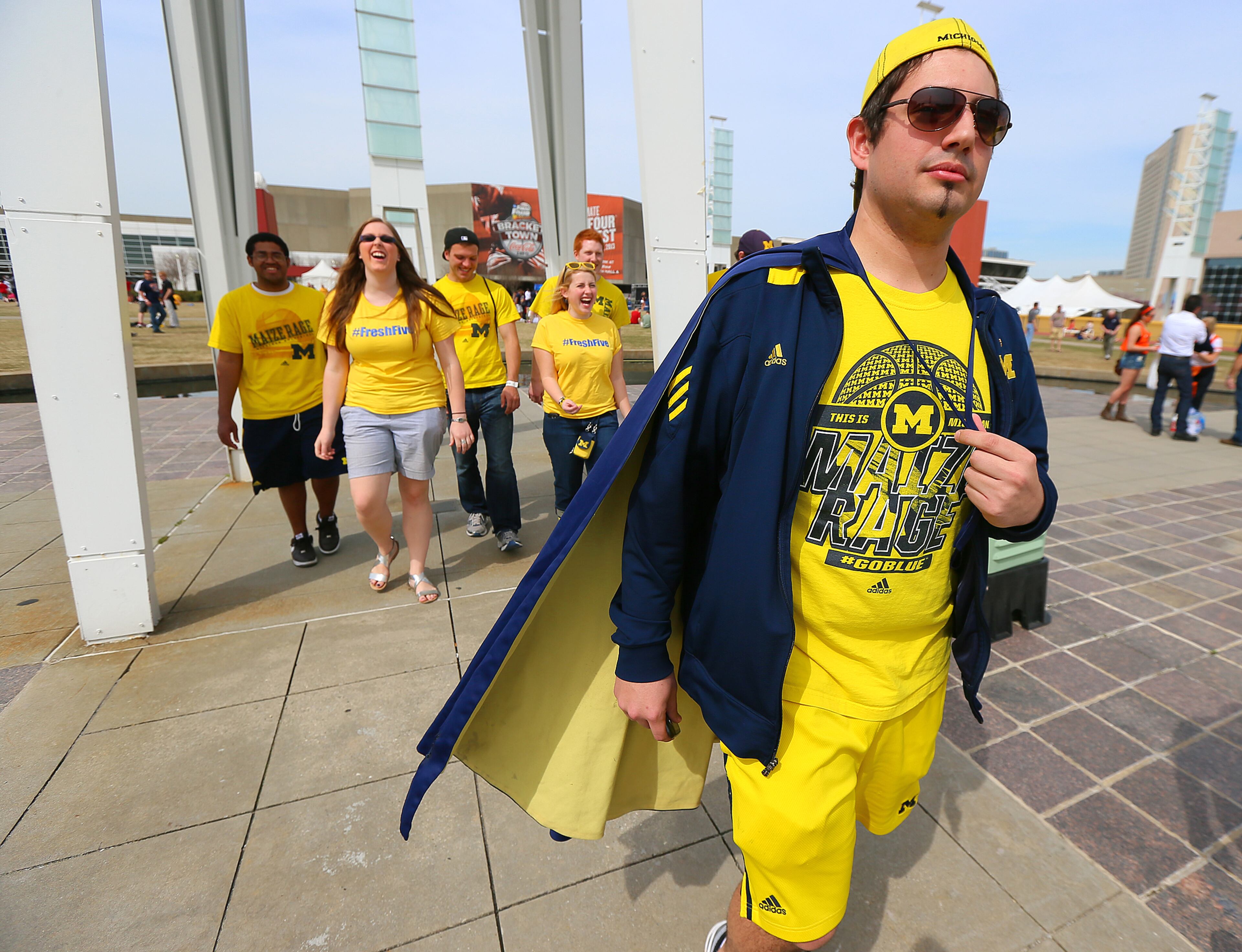 April 6, 2013-ATLANTA: University of Michigan student Jarrett McFeters sports a cape leading fellow students to the Georgia Dome for their Final Four game against Syracuse on Saturday, April 6, 2013, in Atlanta.