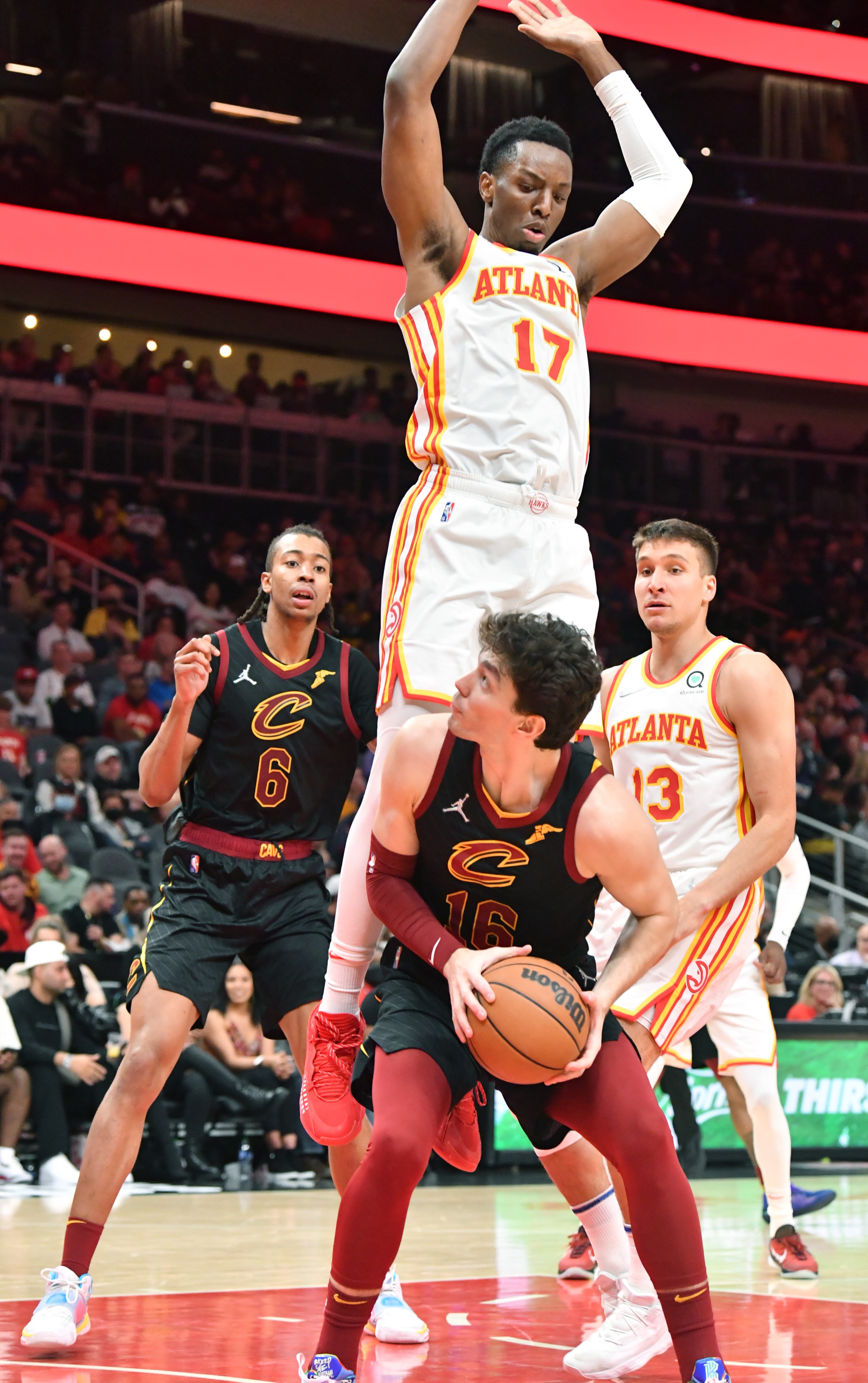 Cleveland Cavaliers' forward Cedi Osman (16) prepares to shoot as Atlanta Hawks' forward Onyeka Okongwu (17) blocks during the second half in an NBA basketball game at State Farm Arena on Thursday, March 31, 2022. Atlanta Hawks won 131-107 over Cleveland Cavaliers. (Hyosub Shin / Hyosub.Shin@ajc.com)