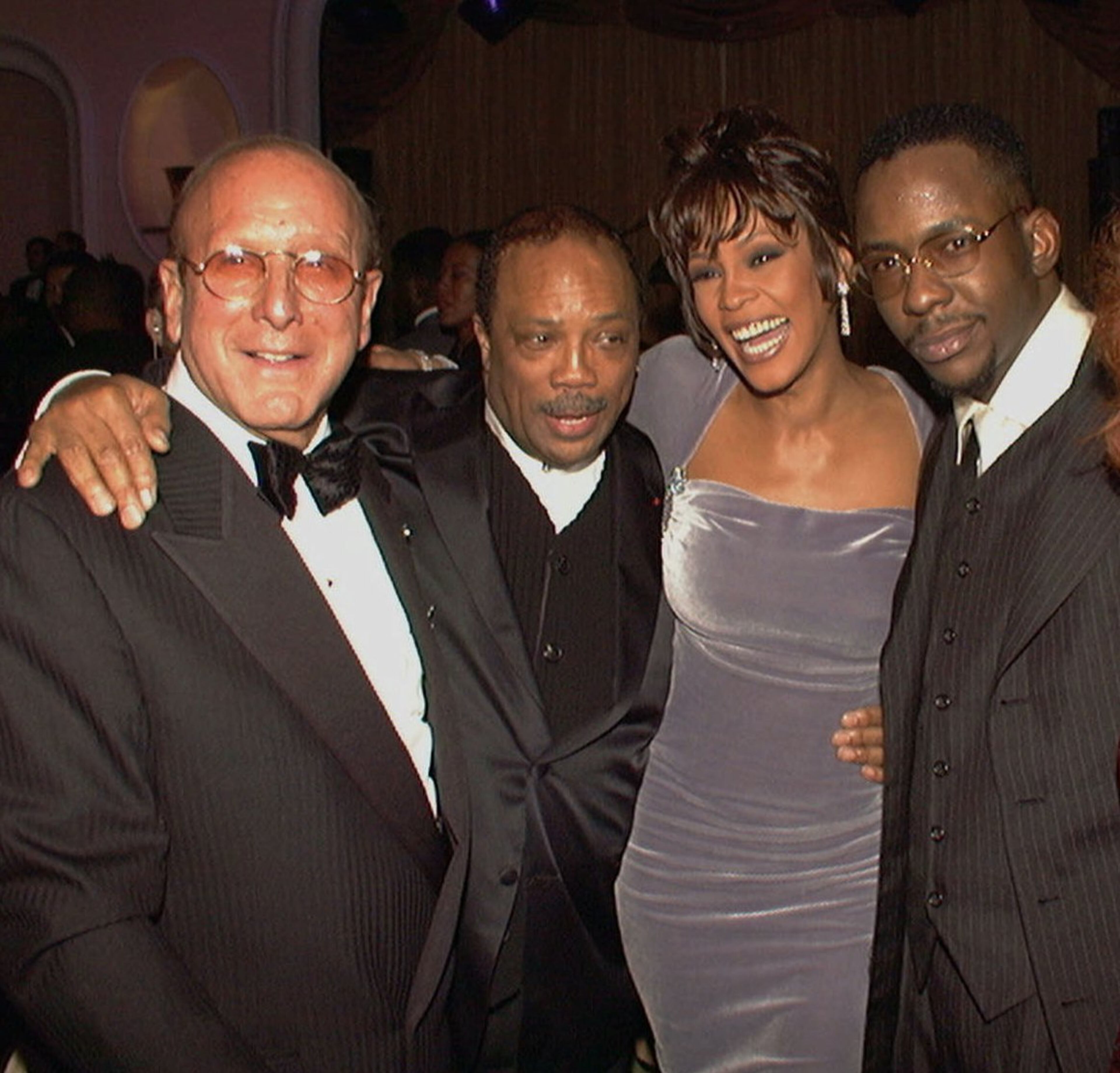 Arista Records head Clive Davis, left, kicks off Grammy week with his 10th annual pre-Grammy party with, from left, Quincy Jones, Whitney Houston, and Bobby Brown in Beverly Hills, Calif., Tuesday, Feb. 27, 1996. (AP Photo/HO)