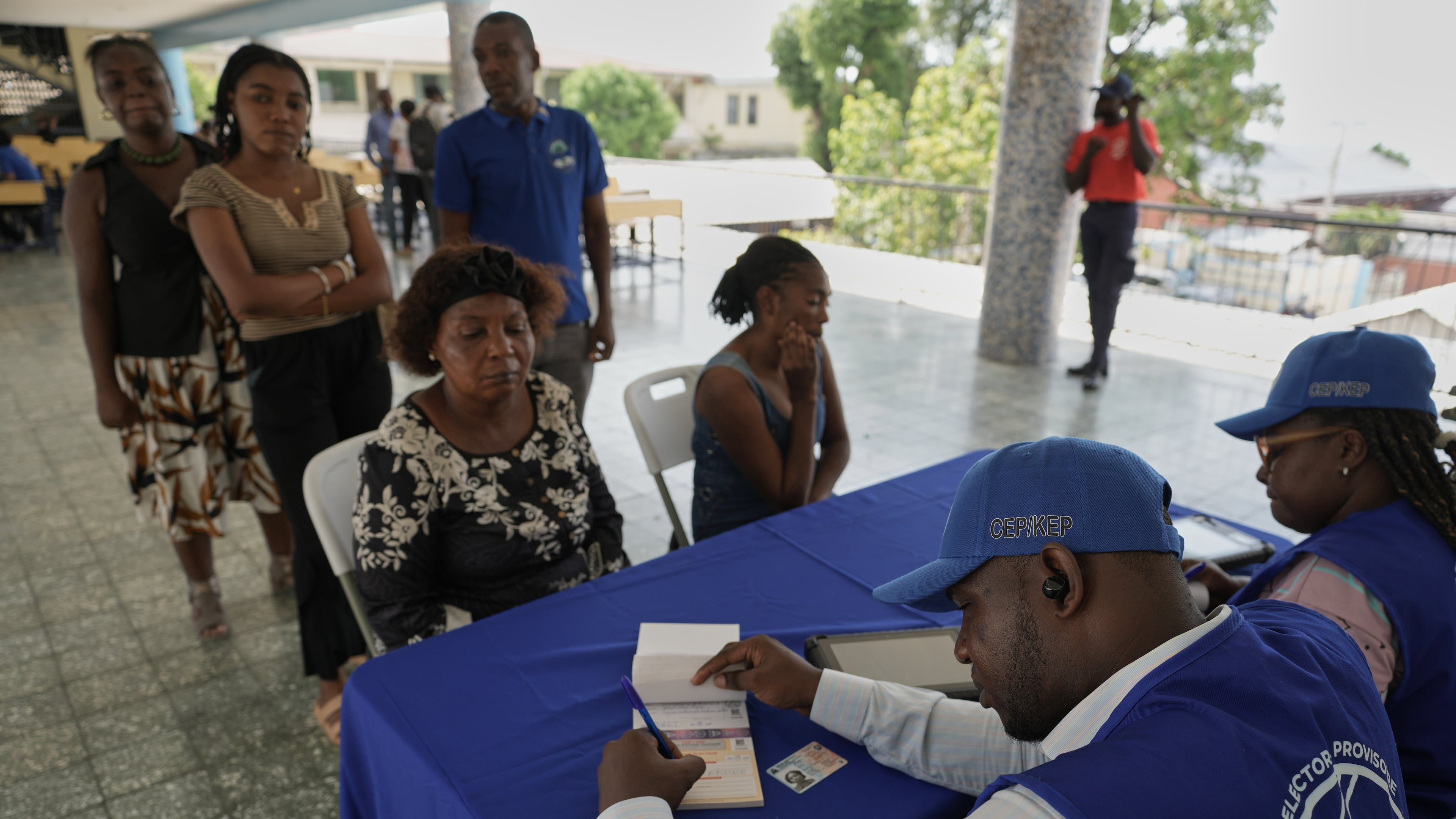 Haitians register to vote in the upcoming general election in Port-au-Prince, Haiti, Thursday, July 30, 2026. (AP Photo/Odelyn Joseph)