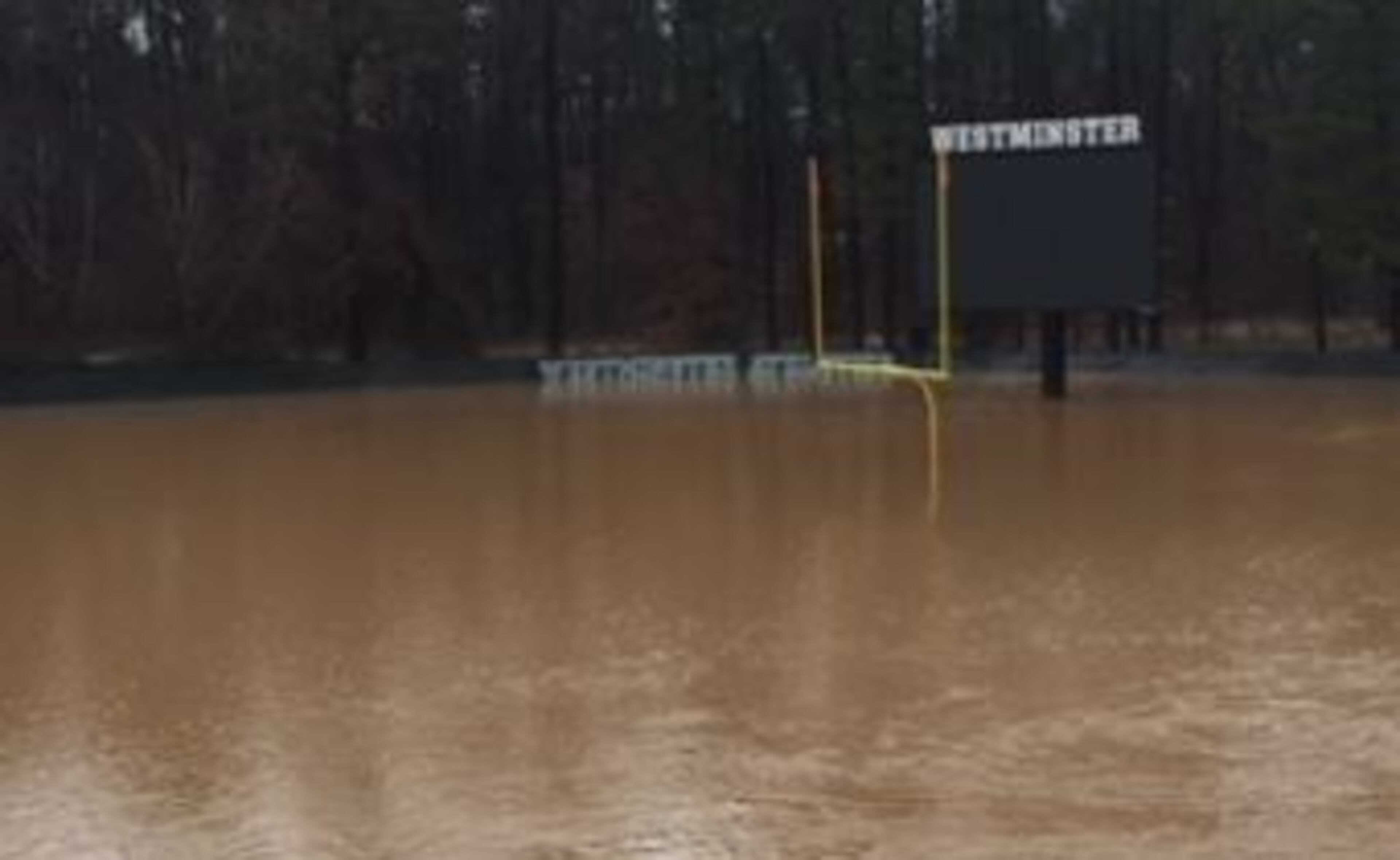 Westminster’s football field was under water Friday after heavy rain in Atlanta. (Photo: Brent McGuire)