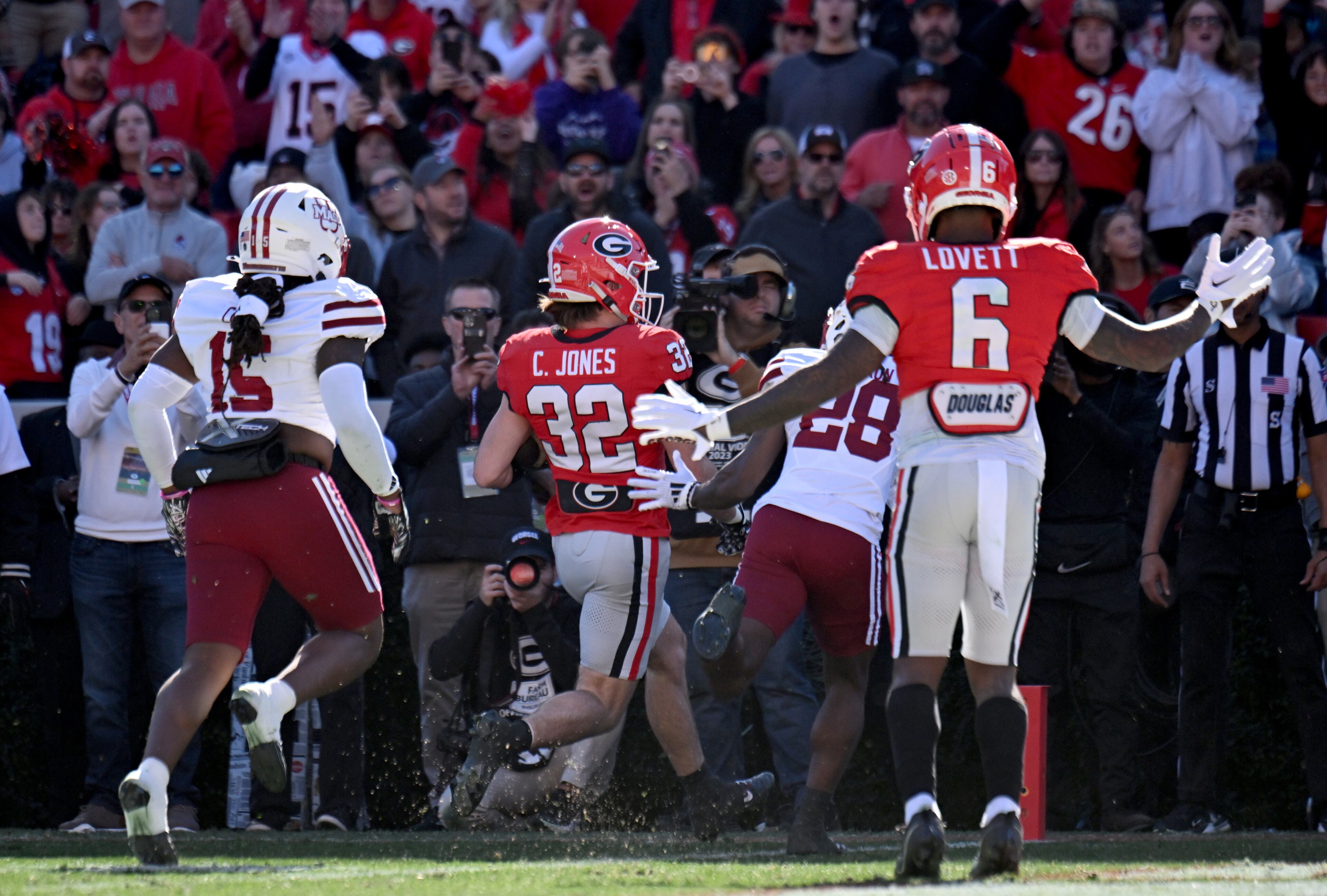 Georgia running back Cash Jones (32) scores a touchdown during the first half in an NCAA football game at Sanford Stadium, Saturday, November 23, 2024, in Athens. (Hyosub Shin / AJC)