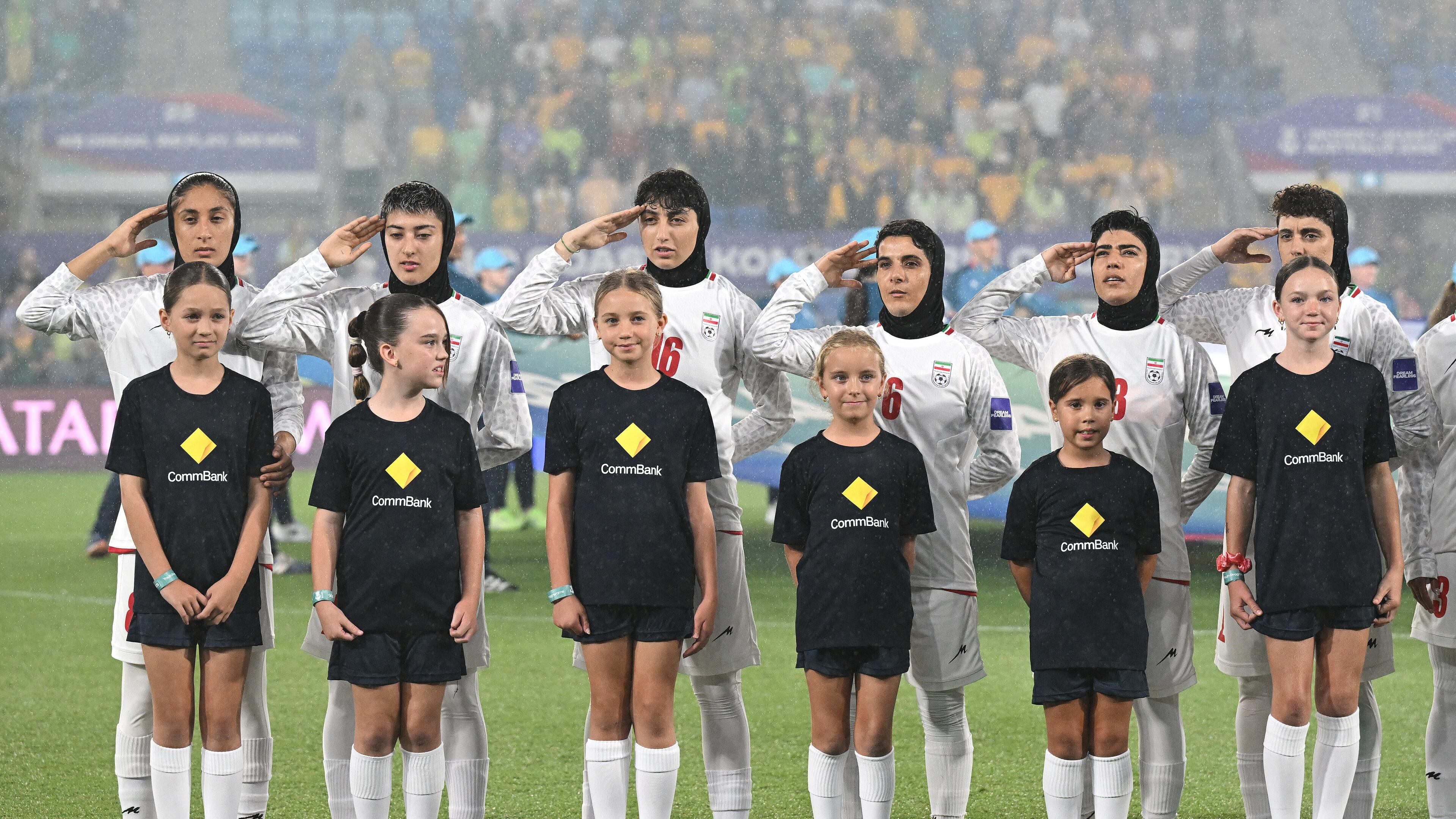 Iran players react during their national anthem ahead of the Women's Asia Cup soccer match between Australia and Iran in Robina, Australia, Thursday, March 5, 2026. (Dave Hunt/AAPImage via AP)