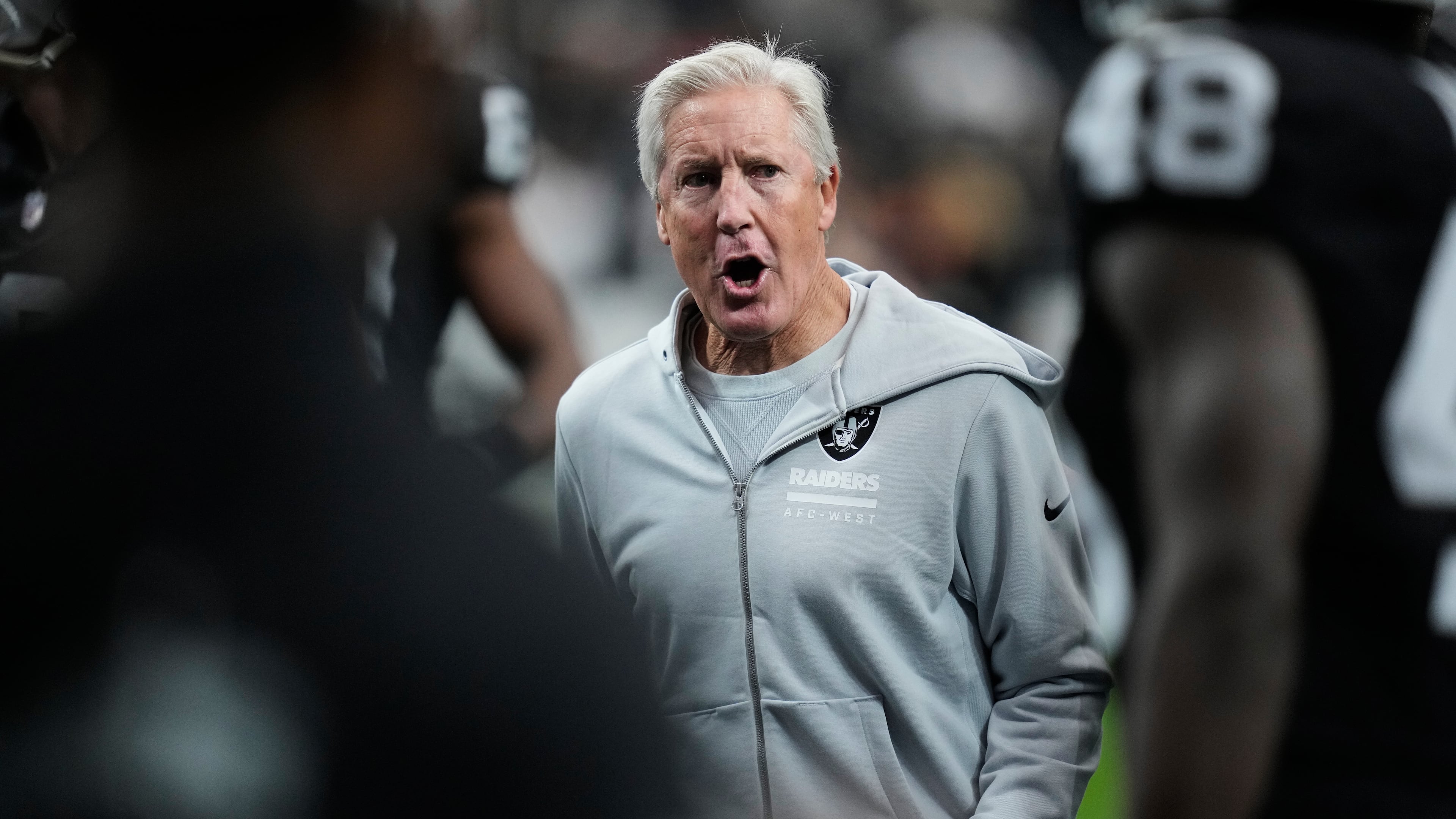 Las Vegas Raiders head coach Pete Carroll watches his team warm up before an NFL football game against the Kansas City Chiefs Sunday, Jan. 4, 2026, in Las Vegas. (AP Photo/John Locher)