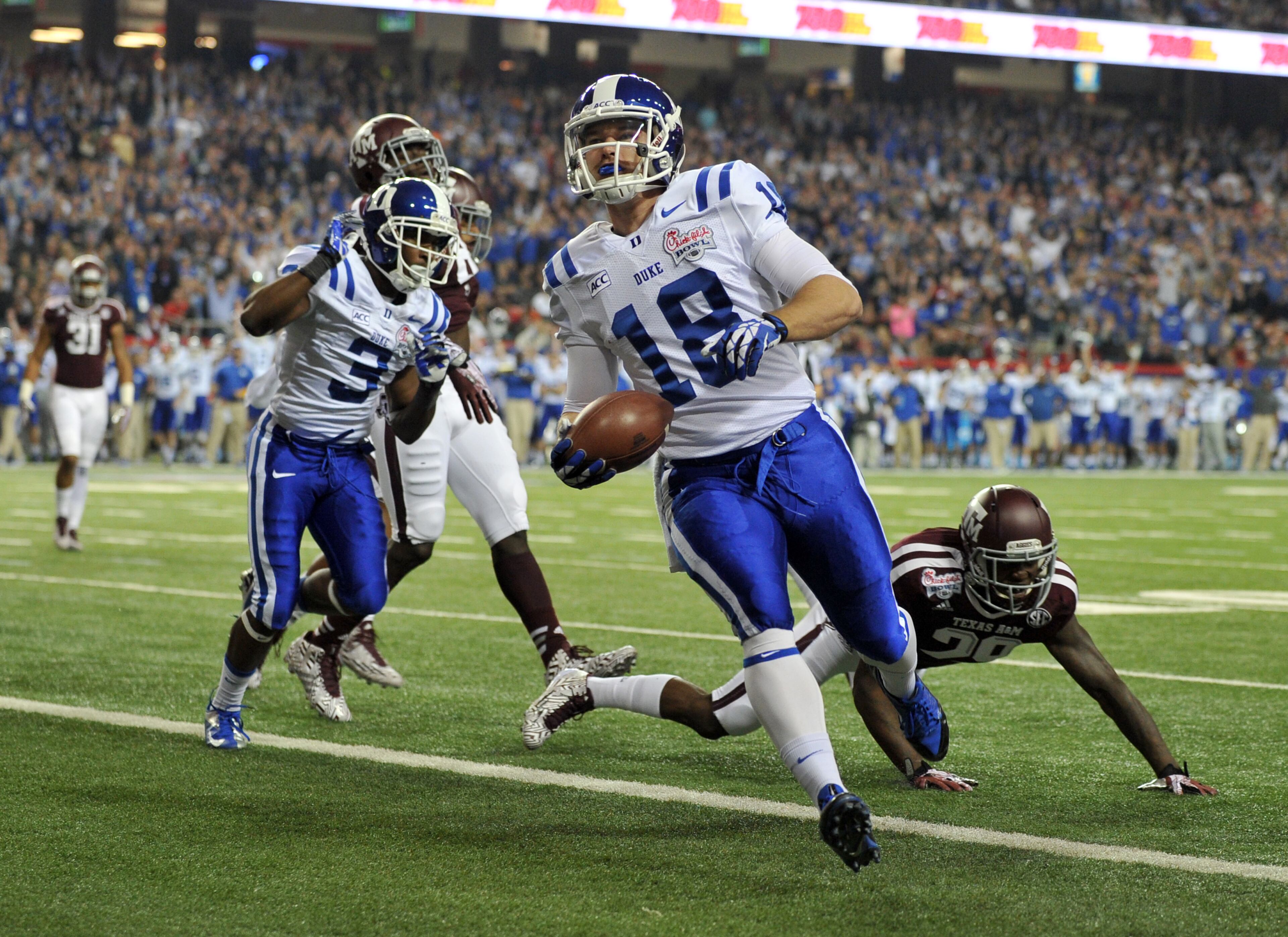 Duke quarterback Brandon Connette scores against Texas A&M during the first quarter of the Chick-fil-A Bowl.