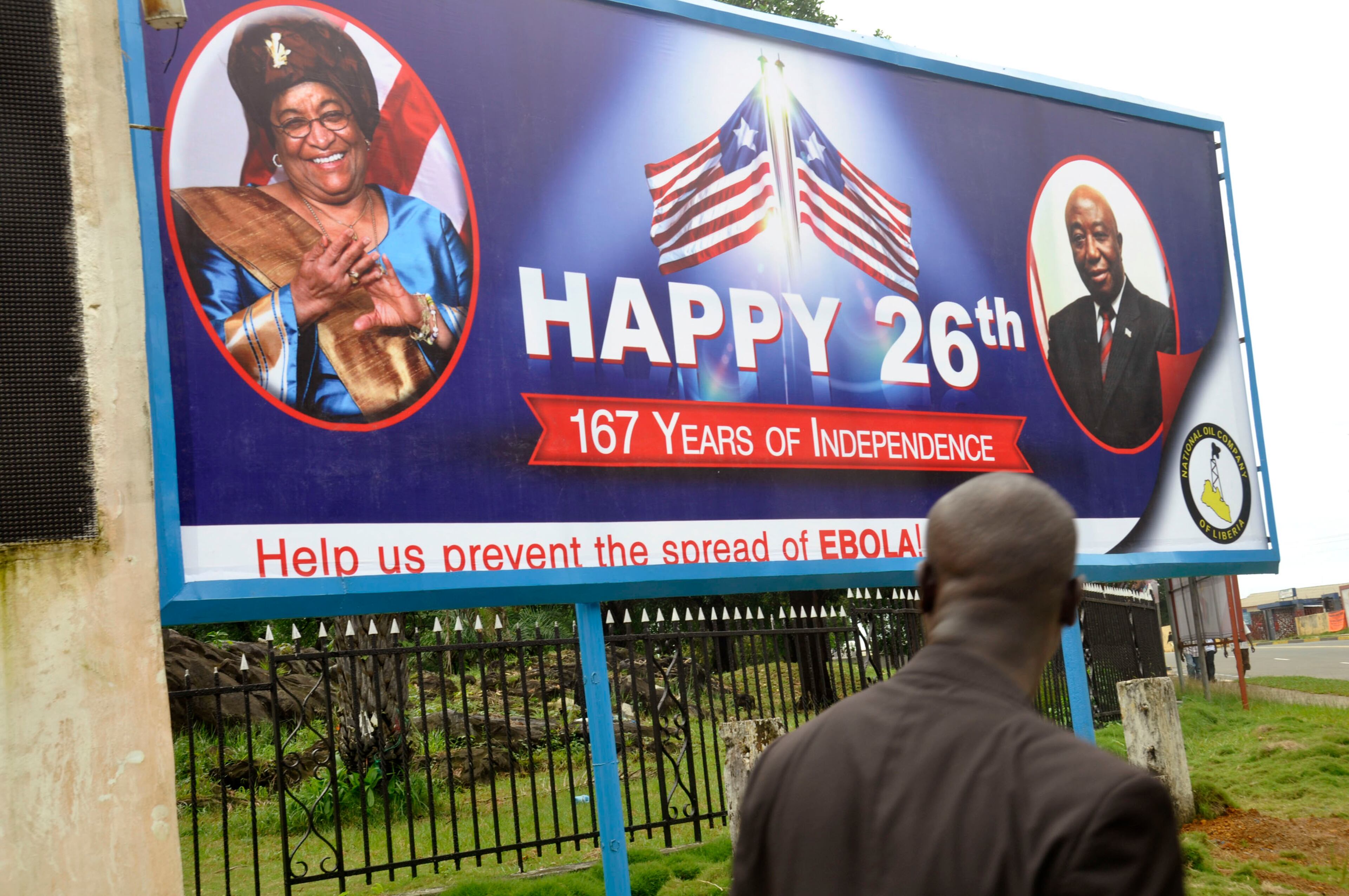 A billboard reading 'Help us prevent the spread of Ebola, center, with the face of Liberia President Ellen Johnson Sirleaf, left, in the city of Monrovia, Liberia, Thursday, July 31, 2014. The worst recorded Ebola outbreak in history surpassed 700 deaths in West Africa as the World Health Organization on Thursday announced dozens of new fatalities. (AP Photo/Abbas Dulleh)