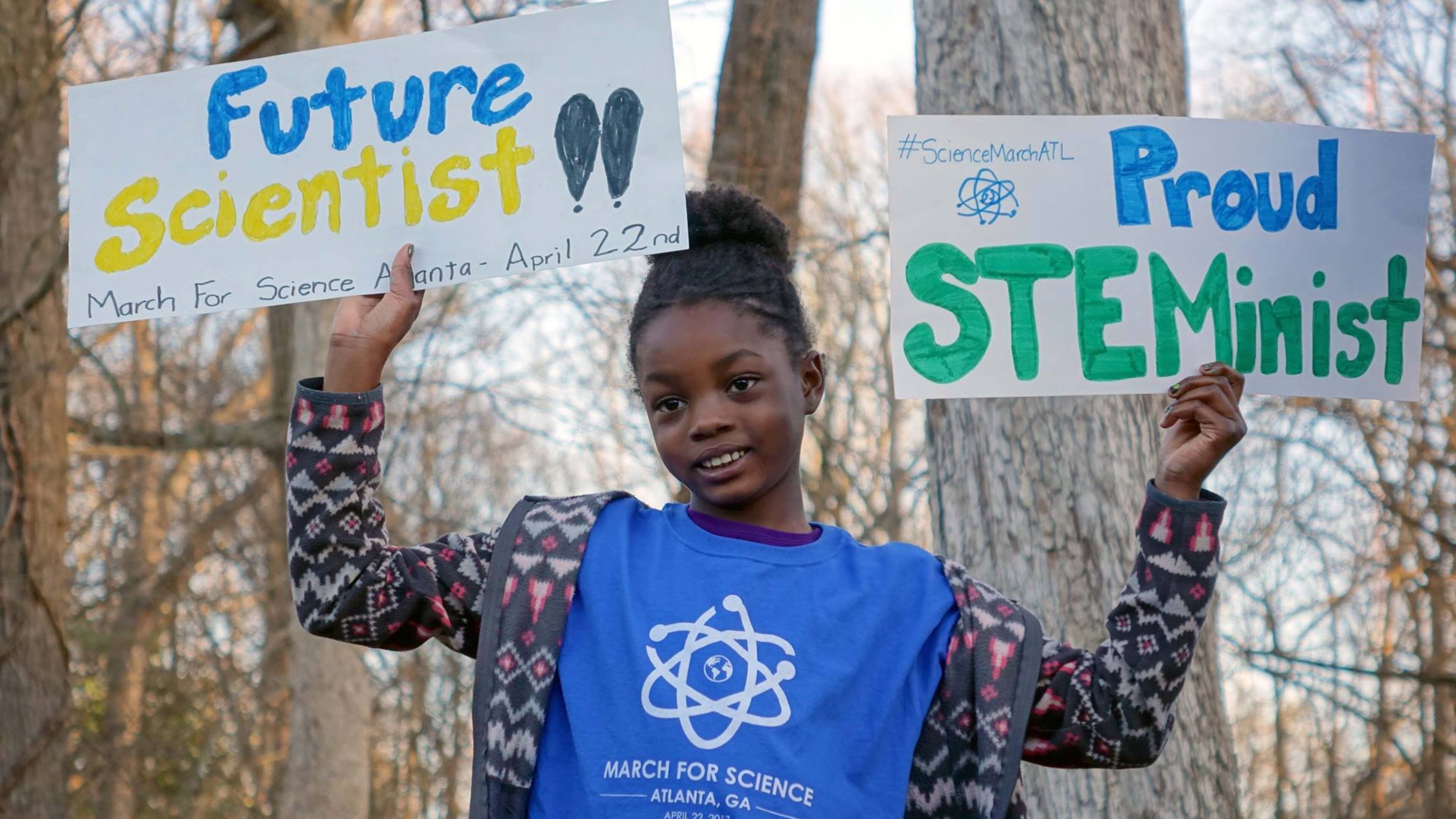 Jayda, the 8-year-old daughter of Atlanta March for Science organizer and Emory microbiologist Jasmine Clark, shows her enthusiasm for science. How do we get more girls to see themselves as scientists? (Photo/Atlanta March for Science)