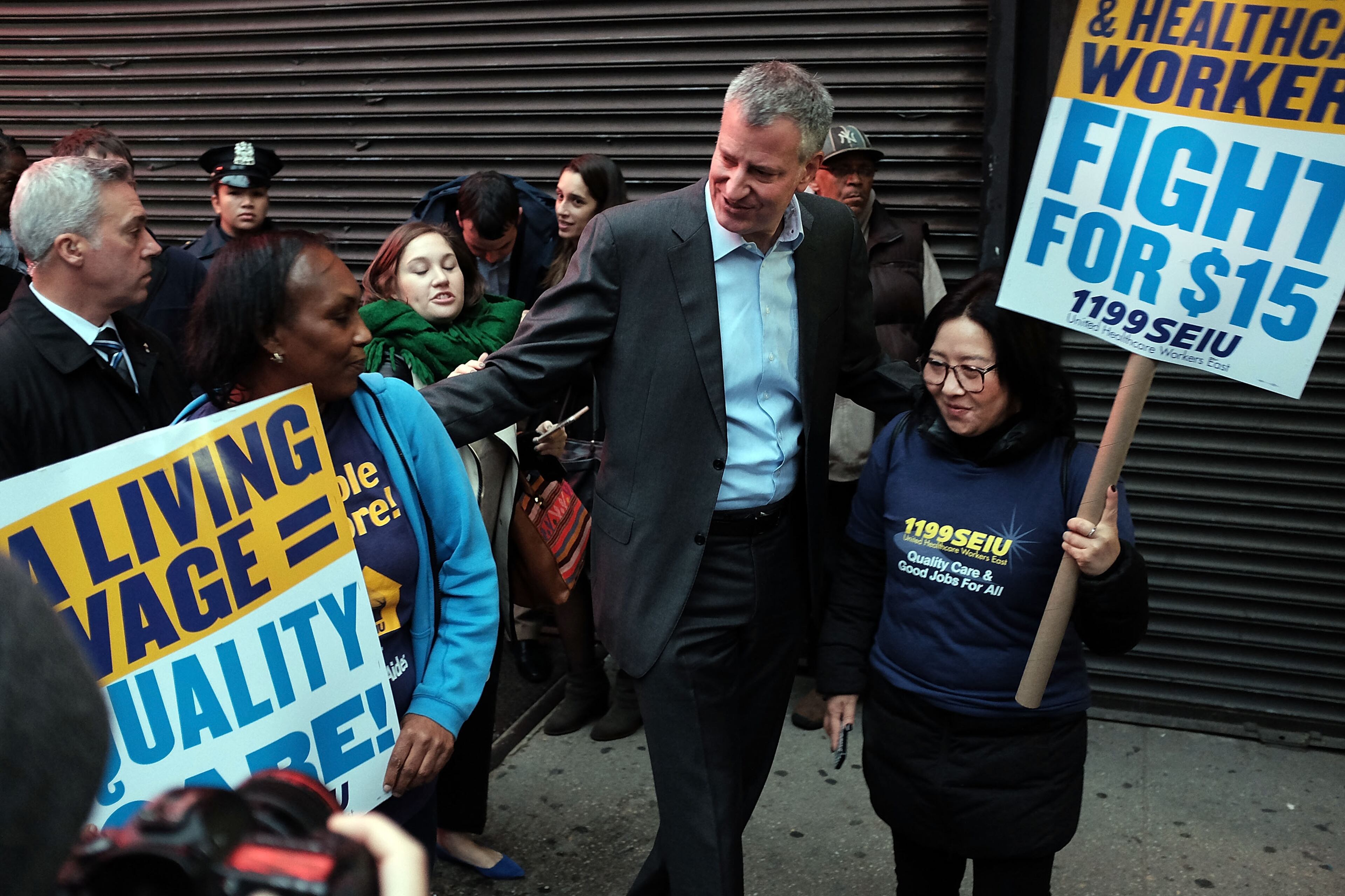 NEW YORK, NY - NOVEMBER 10: New York City Mayor Bill de Blasio makes an appearance in support of low wage workers, many in the fast-food industry, as they join with supporters to demand a minimum wage of $15 an hour on November 10, 2015 in New York, United States. In what organizers are calling a National Day of Action for $15 and hour minimum wage, thousands of people took to the streets across the country to stage protests in front of businesses that are paying some of their workers the minimum wage. Home care workers, employees in retail and fast food restaurants say that the current minimum is not a living wage. (Photo by Spencer Platt/Getty Images)
