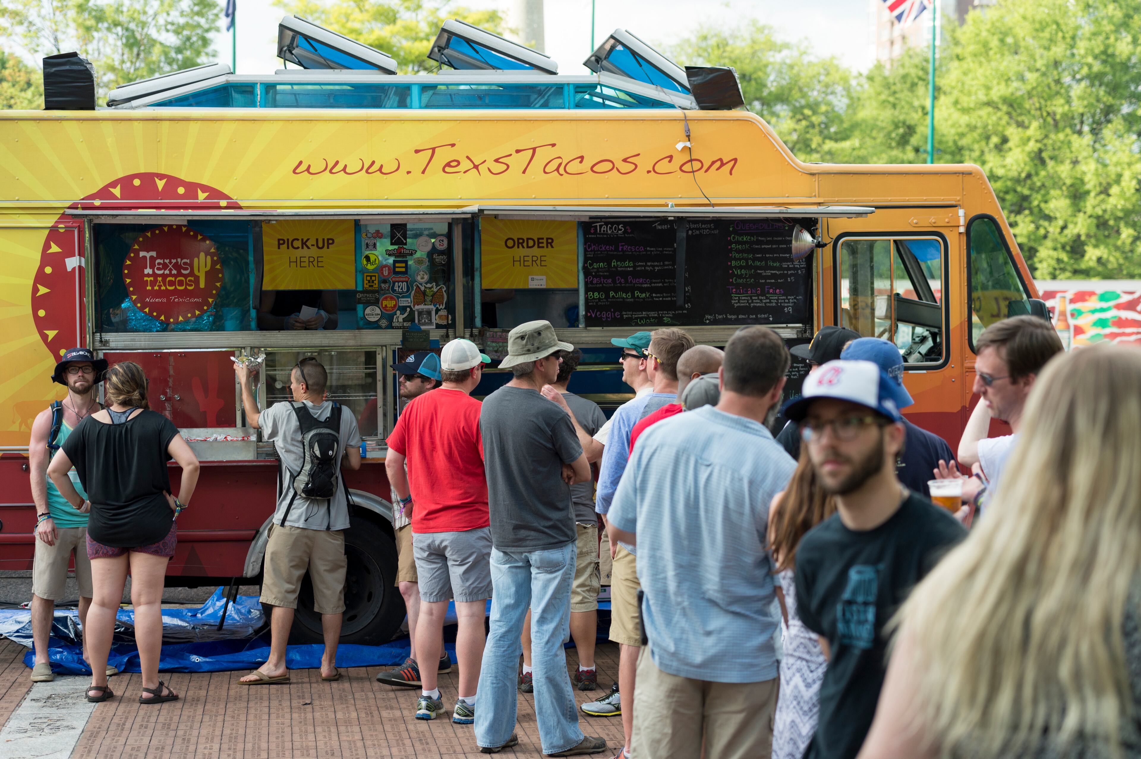 April 21, 2017, Atlanta - Festival goers line up to get food from a food truck at the SweetWater 420 Fest at Centennial Olympic Park in Atlanta, Georgia, on Friday, April 21, 2017. (DAVID BARNES / DAVID.BARNES@AJC.COM)