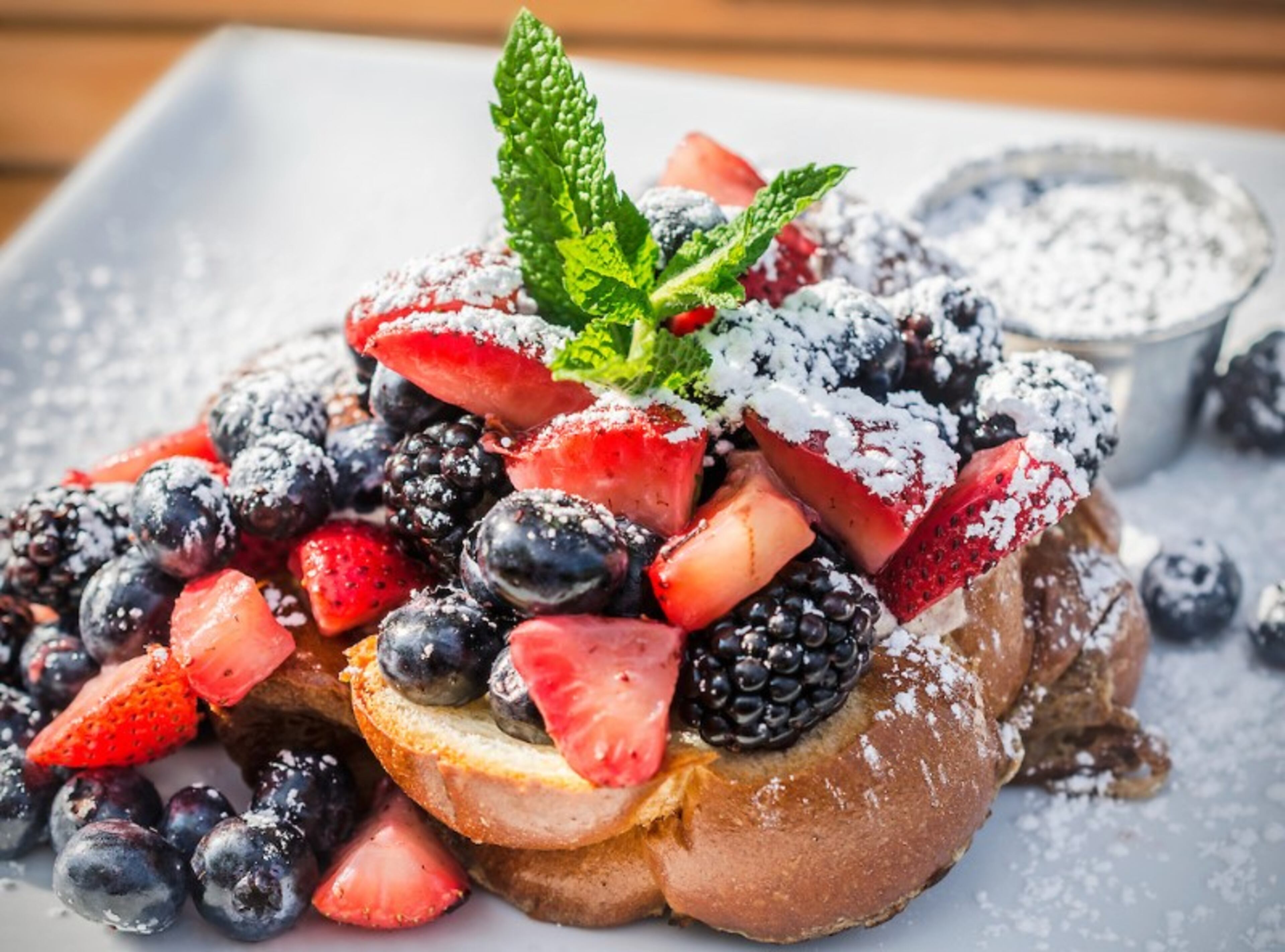 BEST BRUNCH DISHES: Challah French toast stuffed with honeyed ricotta cheese and topped with seasonal fruit from Sun in My Belly. Read more here.