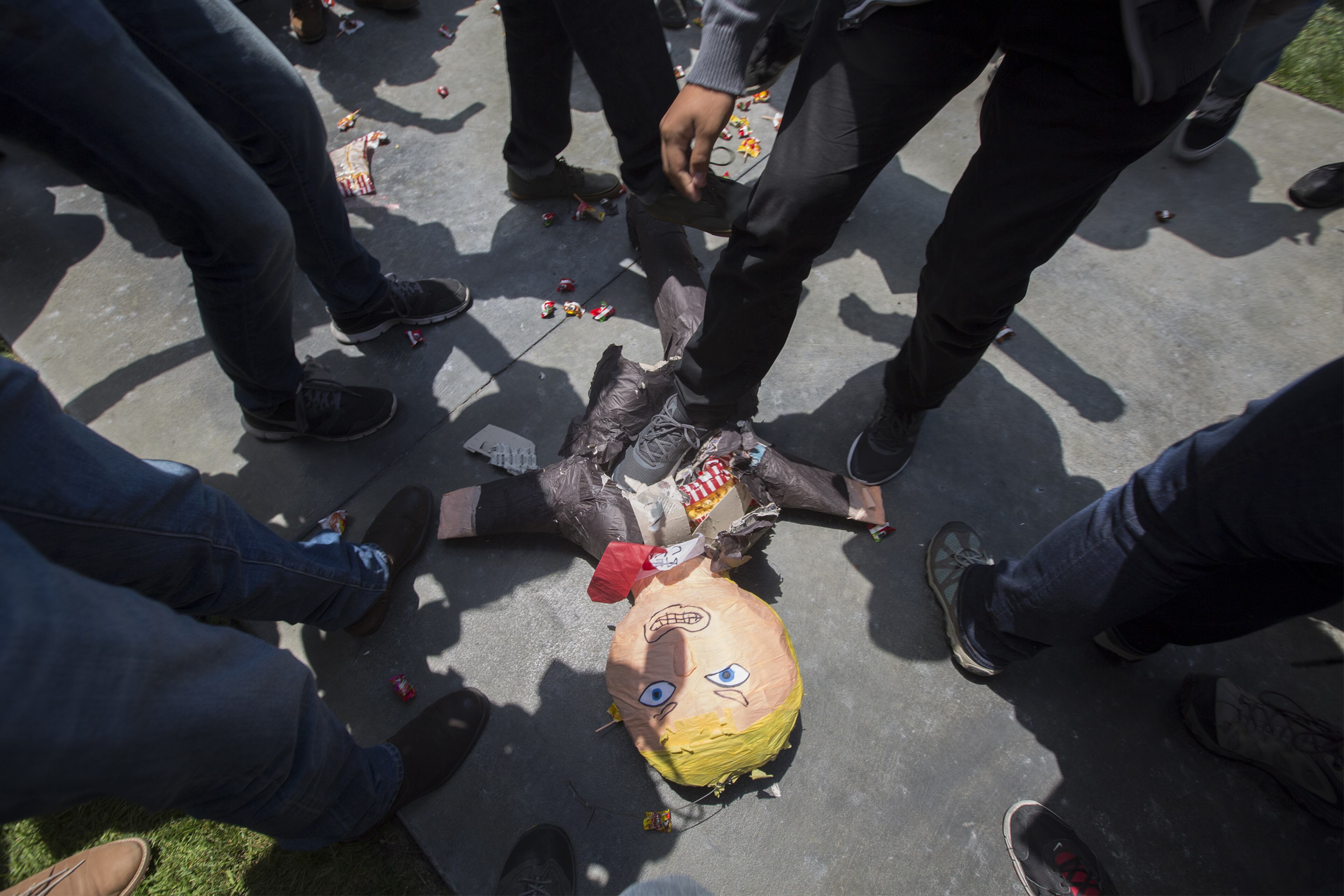 ANAHEIM, CA - MAY 25: Protesters stomp on a Donald Trump pinata near a campaign rally by presumptive GOP presidential candidate Donald Trump at the Anaheim Convention Center on May 25, 2016 in Anaheim, California. Previous visits by the candidate to Orange County have sparked in protests that resulted in some arrests. The presidential candidates are campaigning in Southern California for the June 7 California primary. (Photo by David McNew/Getty Images)