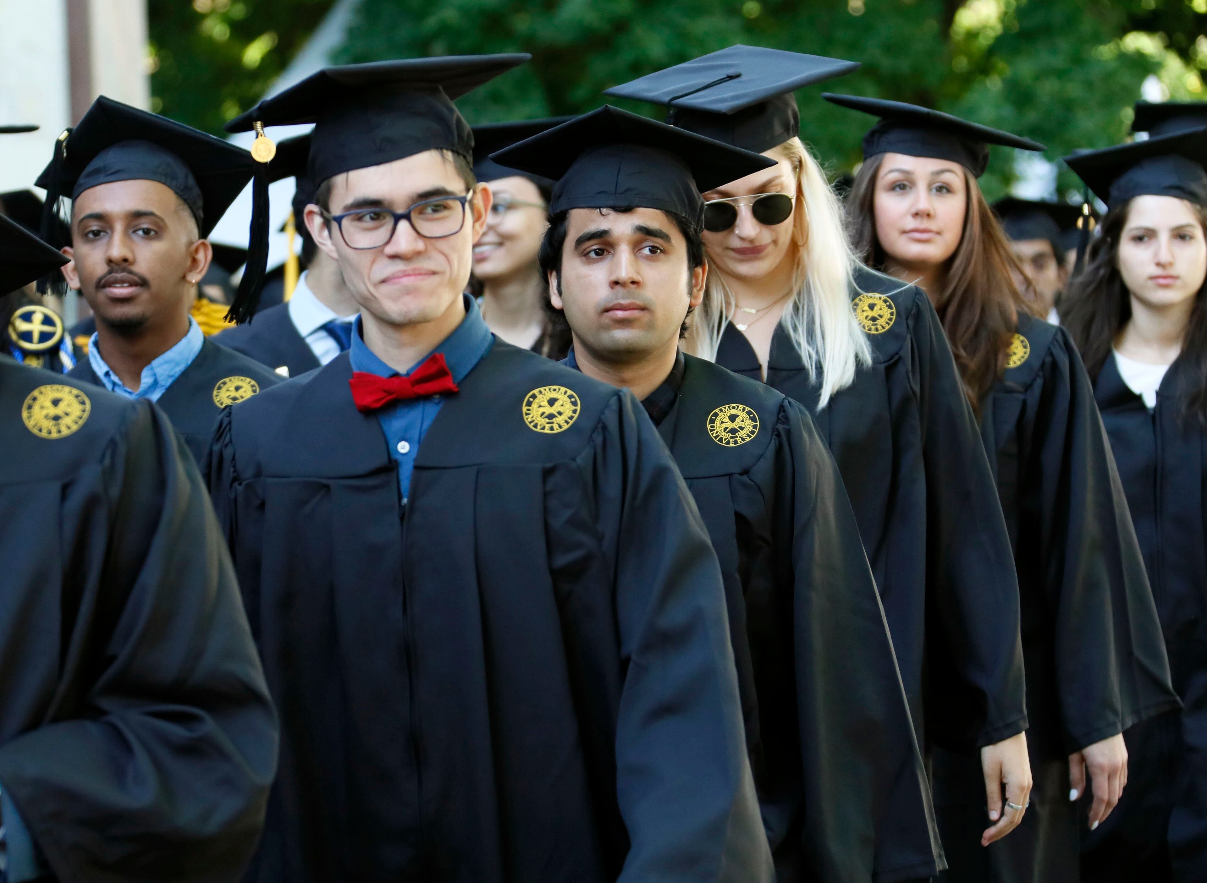 Graduates faces display a variety of emotions as they enter the quad during the processional. Claire E. Sterk, the university's 20th president, presided over the 174th commencement exercises on Monday, May 13, 2019. Andrew Young, former Atlanta mayor and civil rights activist, delivered the keynote address. Bob Andres / bandres@ajc.com