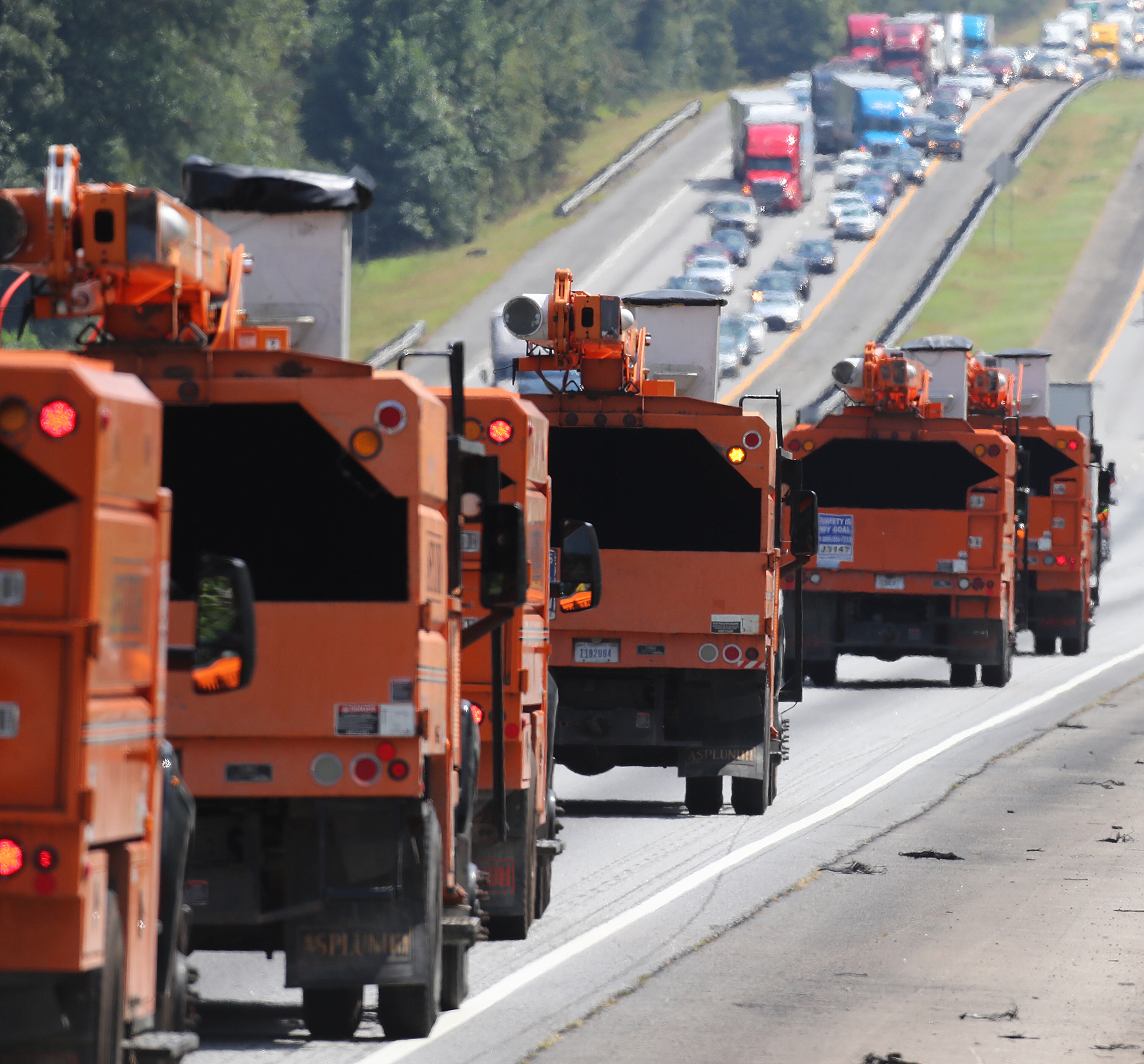 September 8, 2017 Griffin: Traffic on I-75 North fleeing Hurricane Irma backs up moving at a crawl toward Atlanta while power trucks head south toward the Georgia coast in preparation for the storm on Friday, September 8, 2017, in Griffin. Curtis Compton/ccompton@ajc.com