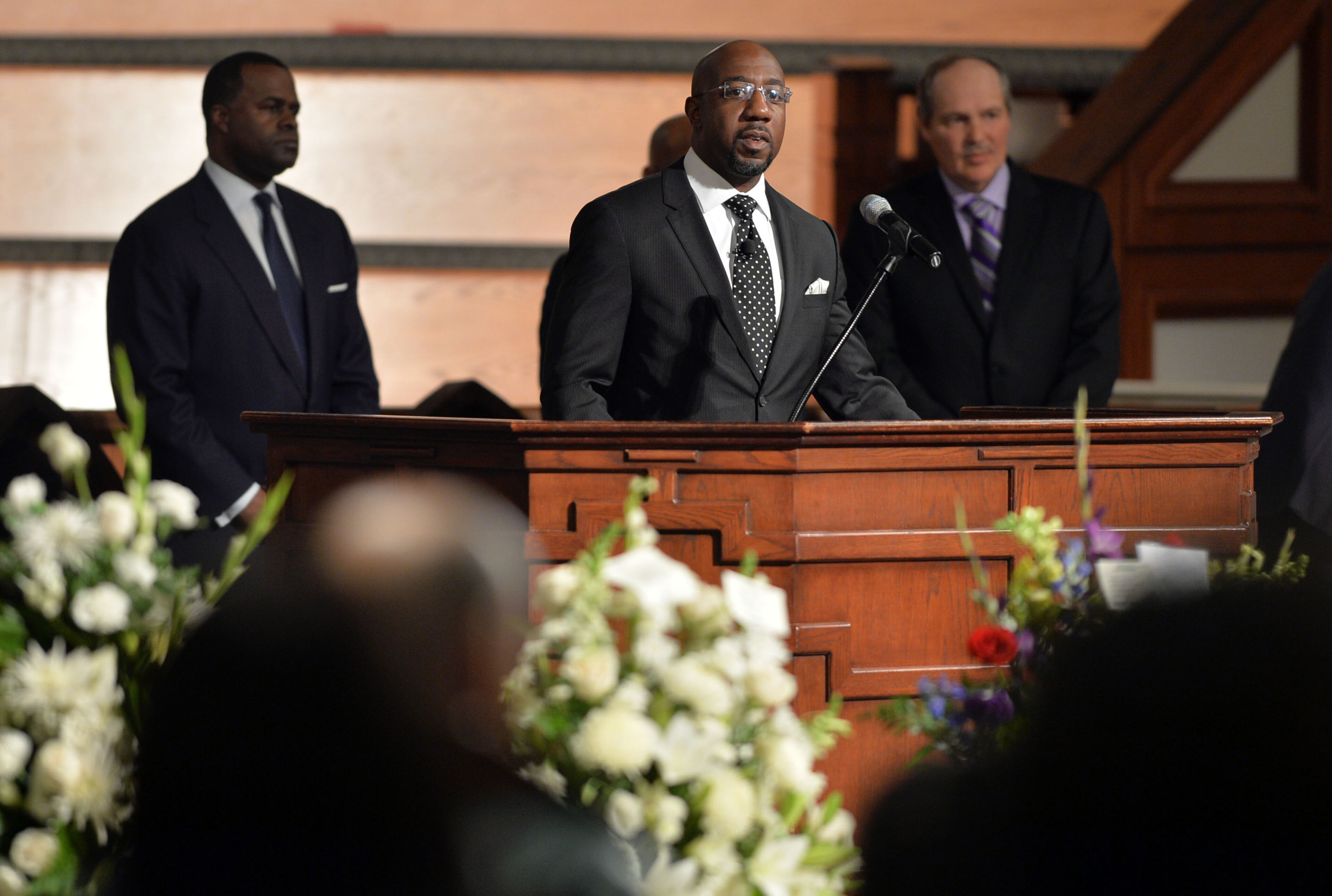 The Rev. Raphael Warnock, pastor of Ebenezer Baptist Church, leads the Call to Remembrance during the service. Wake for Atlanta builder and civil rights leader Herman J. Russell at Ebenezer Baptist Church Friday, November 21, 2014. Among speakers scheduled were Congressman John Lewis, Congressman David Scott, and Atlanta Mayor Kasim Reed. The Reverend Jesse Jackson Sr and Governor Nathan Deal and his wife Sandra, also attended the service. KENT D. JOHNSON/KDJOHNSON@AJC.COM
