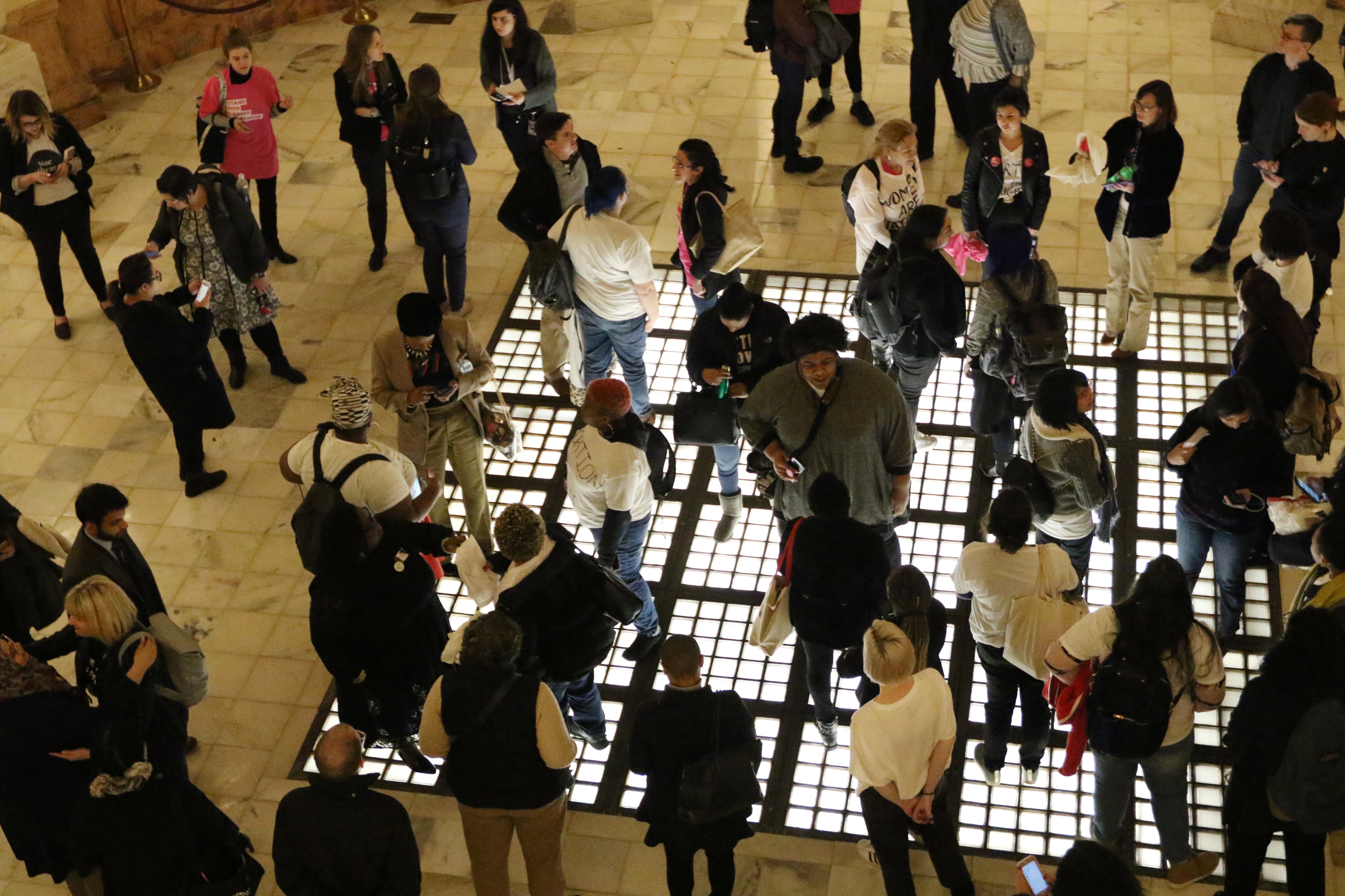 3/7/19 - Atlanta - People gather downstairs after, HB 481, the "heartbeat" bill, is passed at the Georgia State Capitol in Atlanta, Georgia on Thursday, March 7, 2019. Today was the 28th day of the General Assembly, "crossover" day. EMILY HANEY / emily.haney@ajc.com