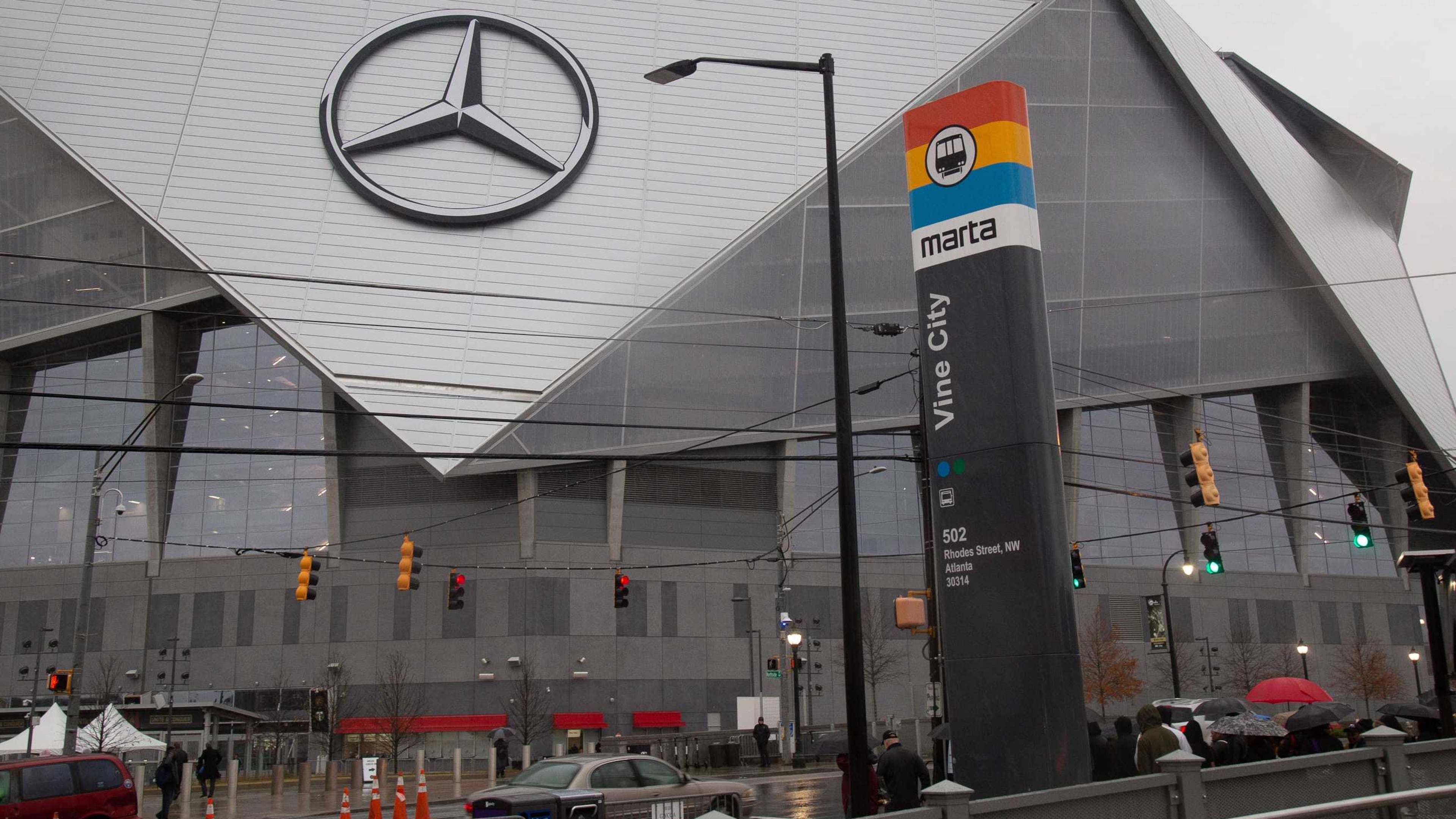 Fans cross the street after exiting from the Vine City MARTA station as they head for the Mercedes Benz Stadium for the start of the MLS championship game on Saturday, November 8, 2018. The Atlanta stadium will be the site of World Cup events this summer and next. (Steve Schaefer for the AJC)