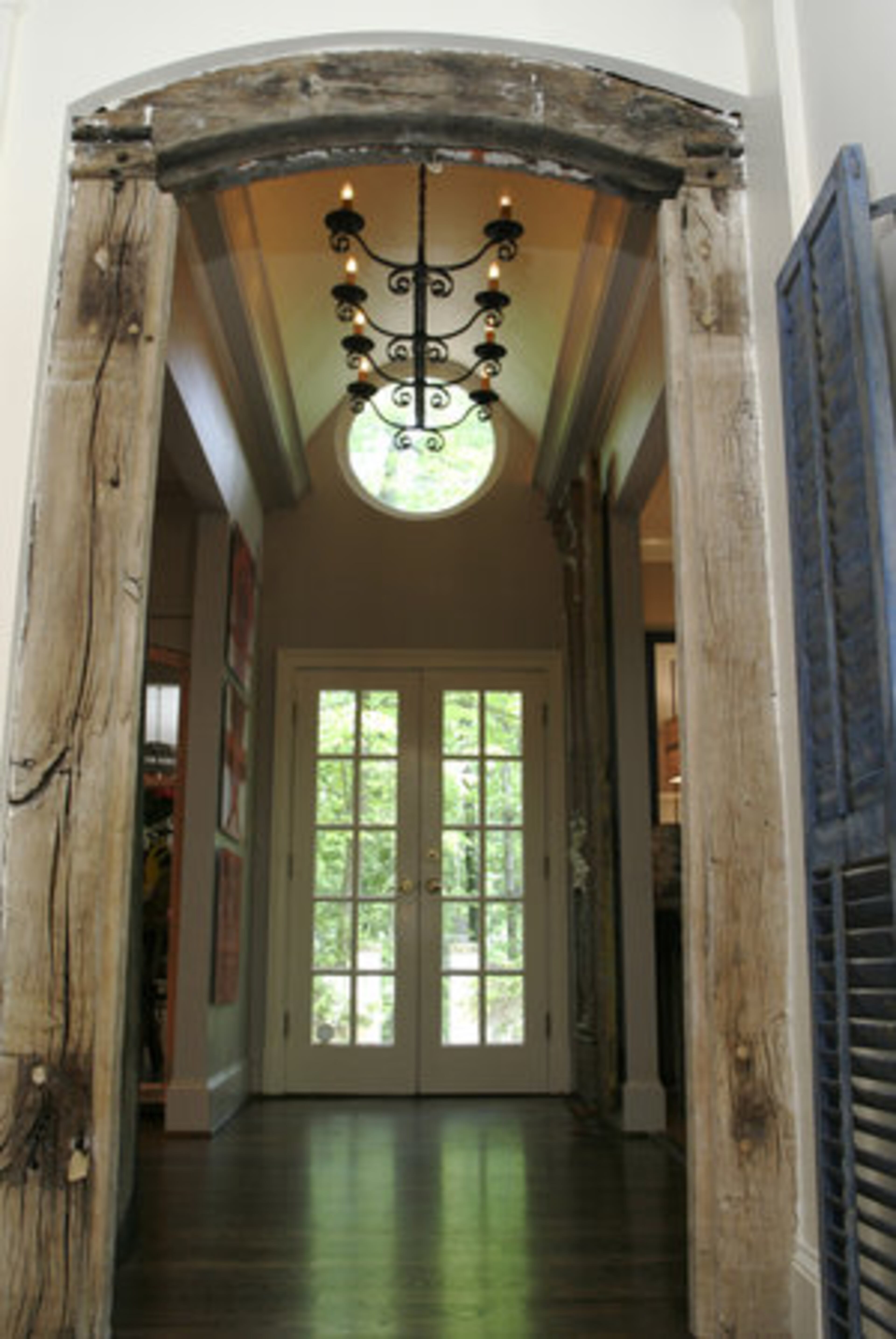 The light fixture in this perspective of the foyer was sourced in France.