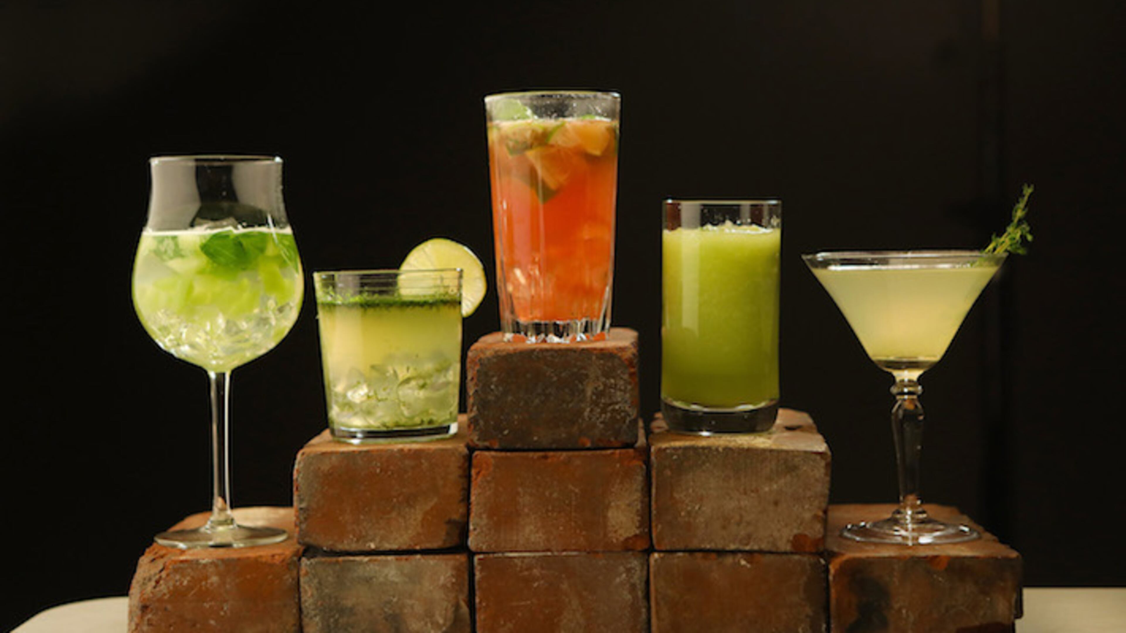 From left, Honeydew Basil Spritzer, Lime Vodka, Chasing Basil Cocktail, Minty Cucumber Melon Drink, and Thyme Lemondade. (J.B. Forbes/St. Louis Post-Dispatch/TNS)