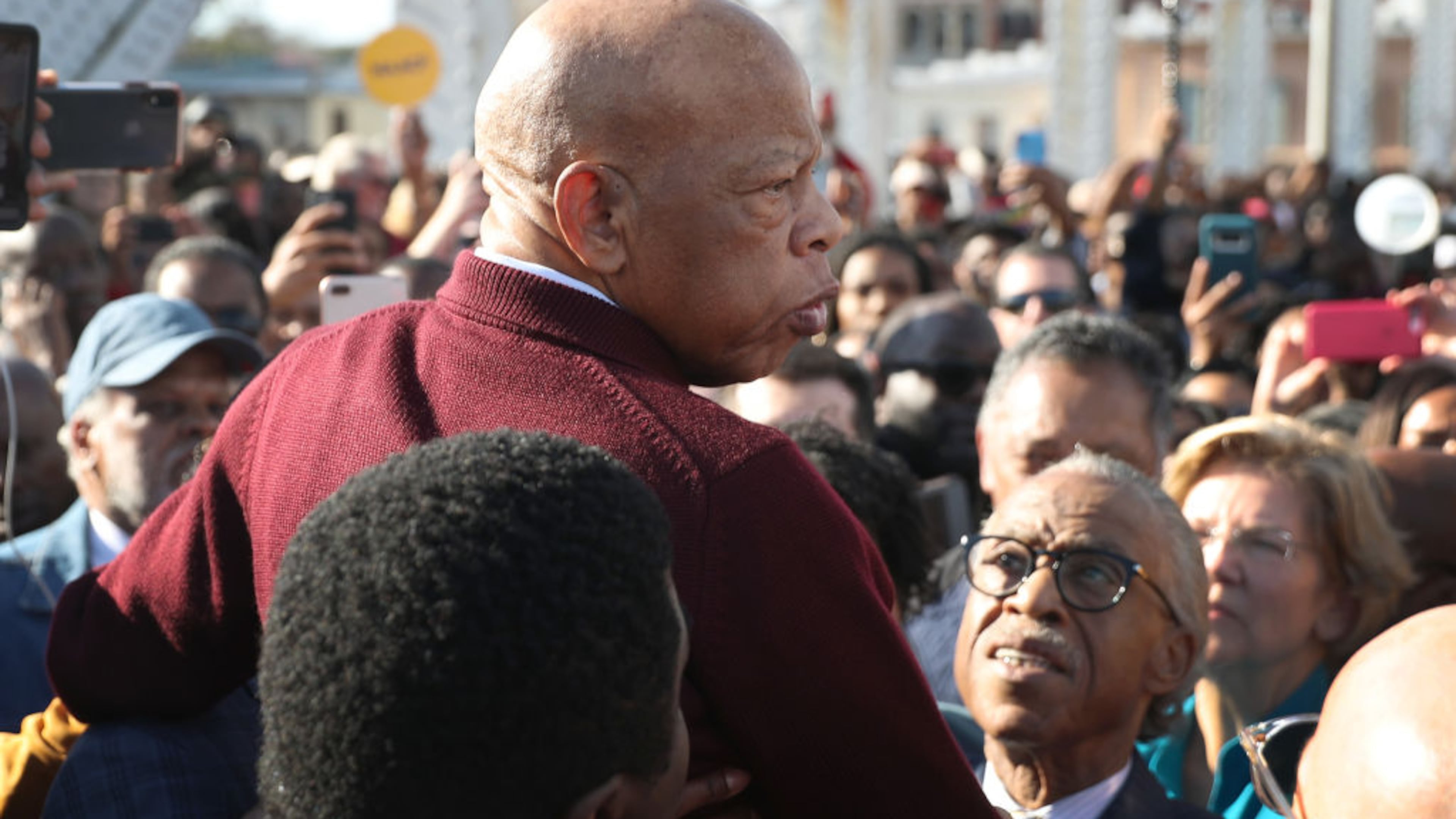 SELMA, ALABAMA - MARCH 01: Rep. John Lewis (D-GA) is held aloft by Rev. Al Sharpton and others as he speaks to the crowd at the Edmund Pettus Bridge crossing reenactment marking the 55th anniversary of Selma's Bloody Sunday on March 1, 2020 in Selma, Alabama. Mr. Lewis marched for civil rights across the bridge 55 years ago. Some of the 2020 Democratic presidential candidates attended the Selma bridge crossing jubilee ahead of Super Tuesday. (Photo by Joe Raedle/Getty Images)