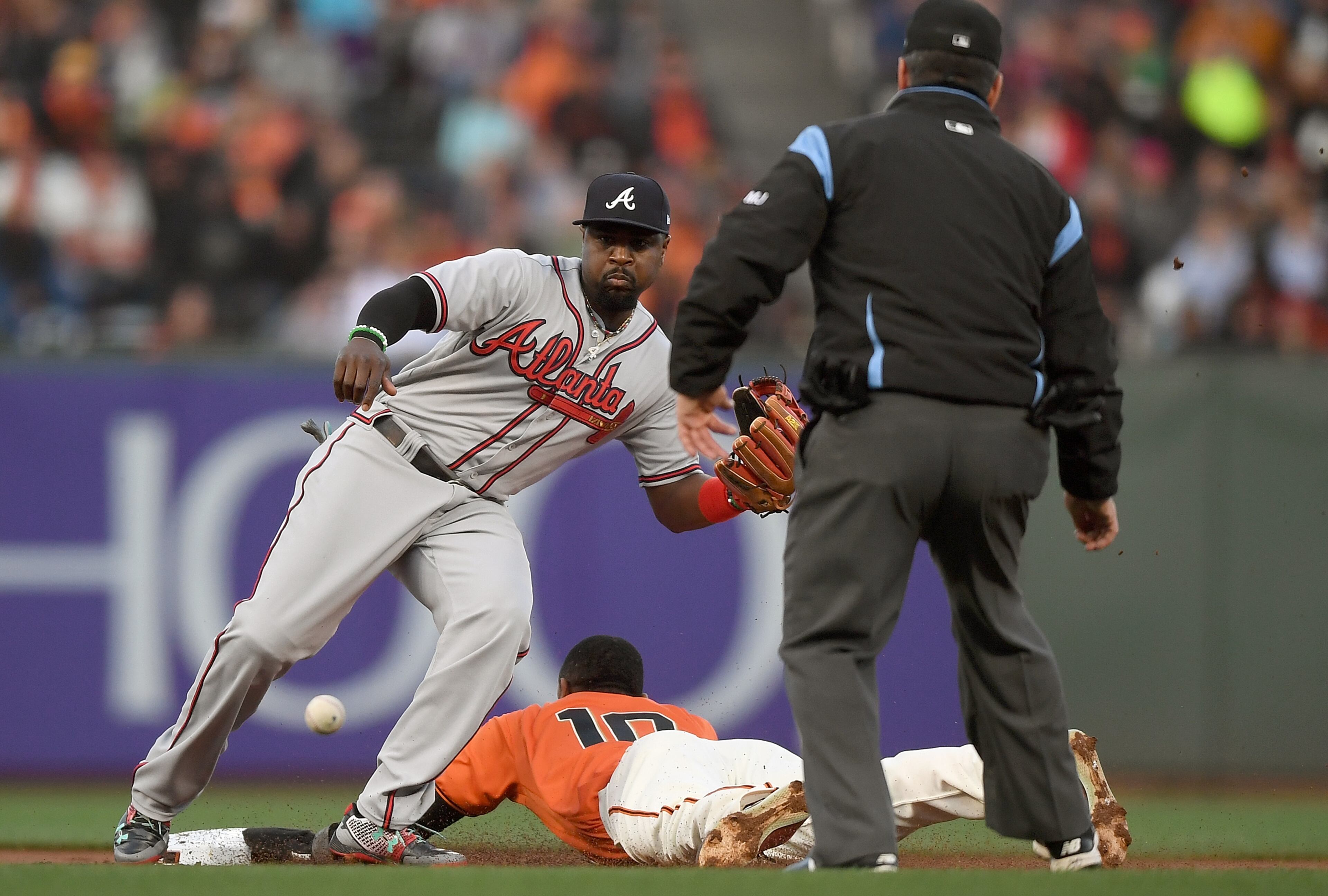 SAN FRANCISCO, CA - MAY 26: Eduardo Nunez #10 of the San Francisco Giants steals second base beating the throw down to Brandon Phillips #4 of the Atlanta Braves in the bottom of the first inning at AT&T Park on May 26, 2017 in San Francisco, California. (Photo by Thearon W. Henderson/Getty Images)