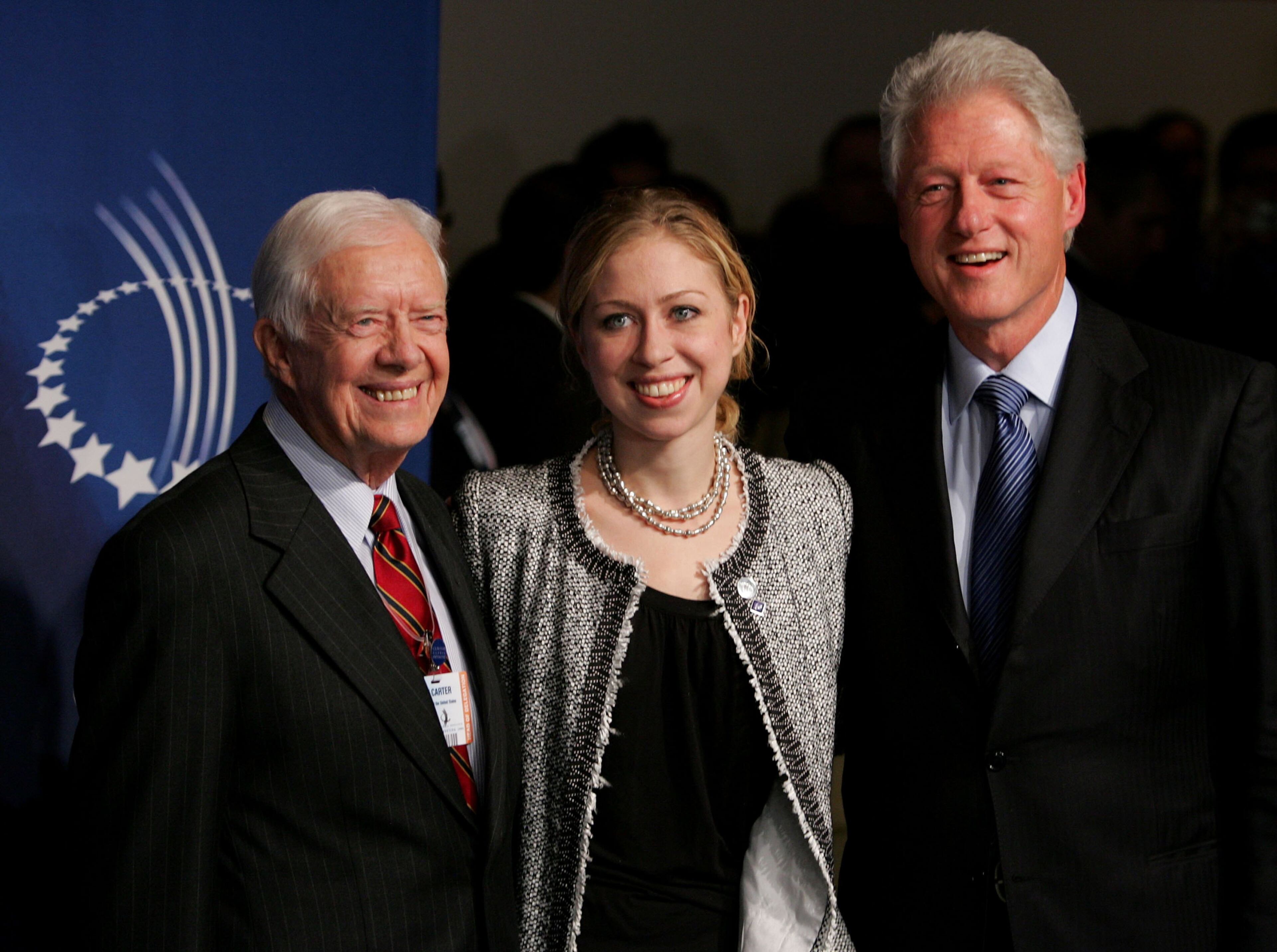 (L-R) Former U.S. President Jimmy Carter, Chelsea Clinton and former U.S. President Bill Clinton attend the opening night reception of The Clinton Global Initiative at the Museum Of Modern Art on September 20, 2006 in New York City. (Photo by Peter Kramer/Getty Images)