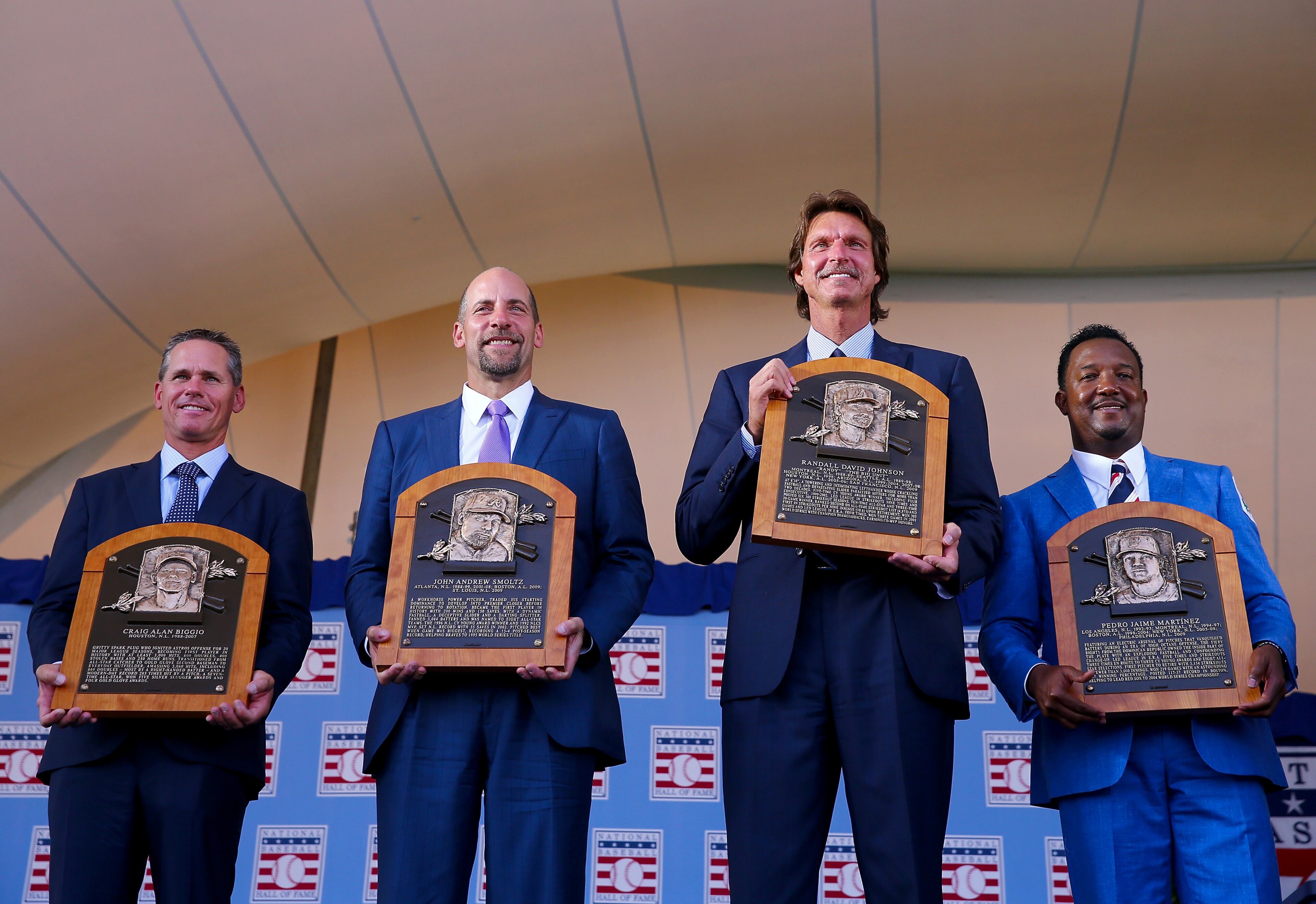 COOPERSTOWN, NY - JULY 26: 2015 Inductees Craig Biggio,John Smoltz,Randy Johnson and Pedro Martinez pose with their plaques after the Induction Ceremony at National Baseball Hall of Fame on July 26, 2015 in Cooperstown, New York. (Photo by Elsa/Getty Images)
