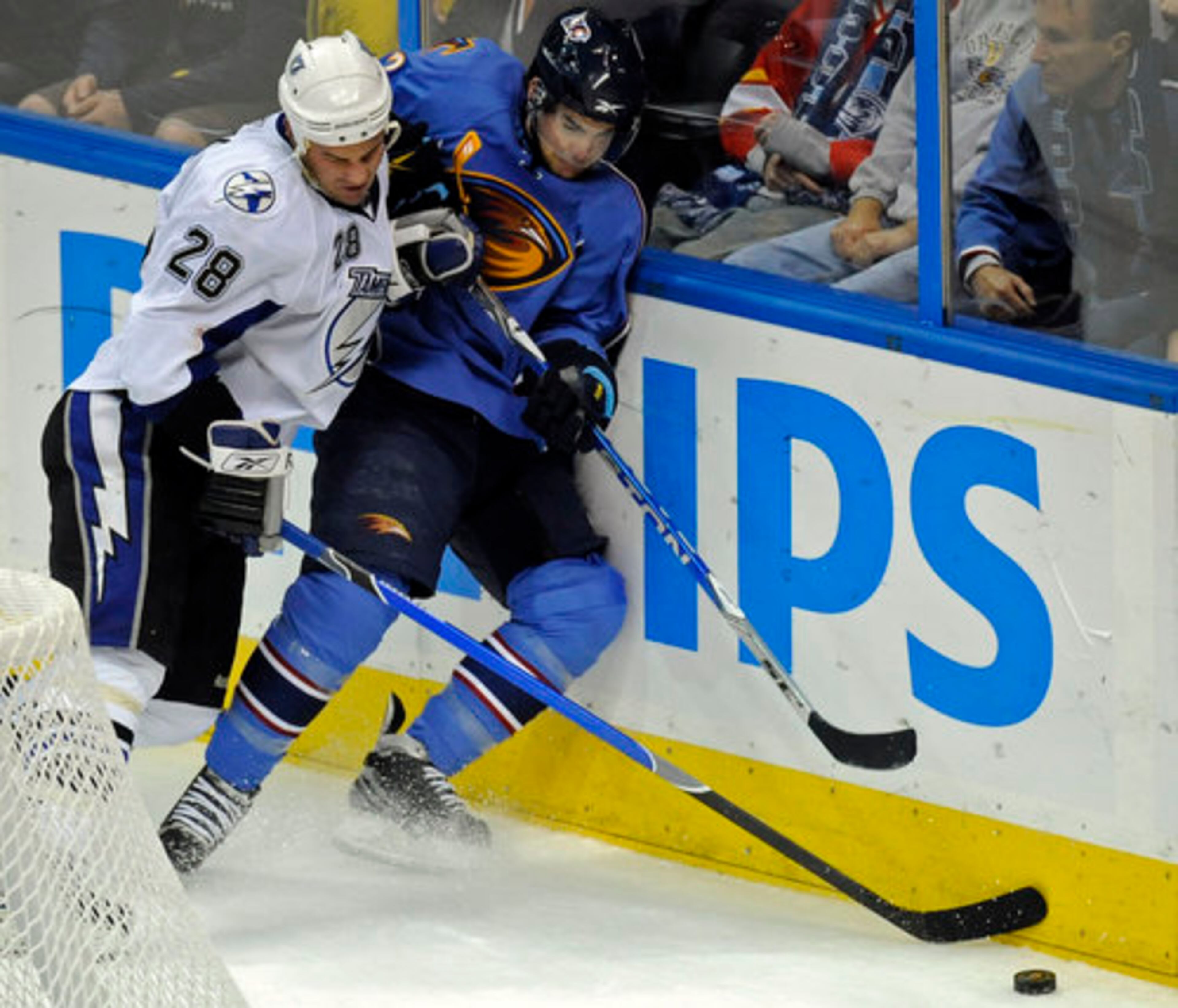 The Lightning's Zenon Konopka crushes Thrasher Jim Slater into the wall.