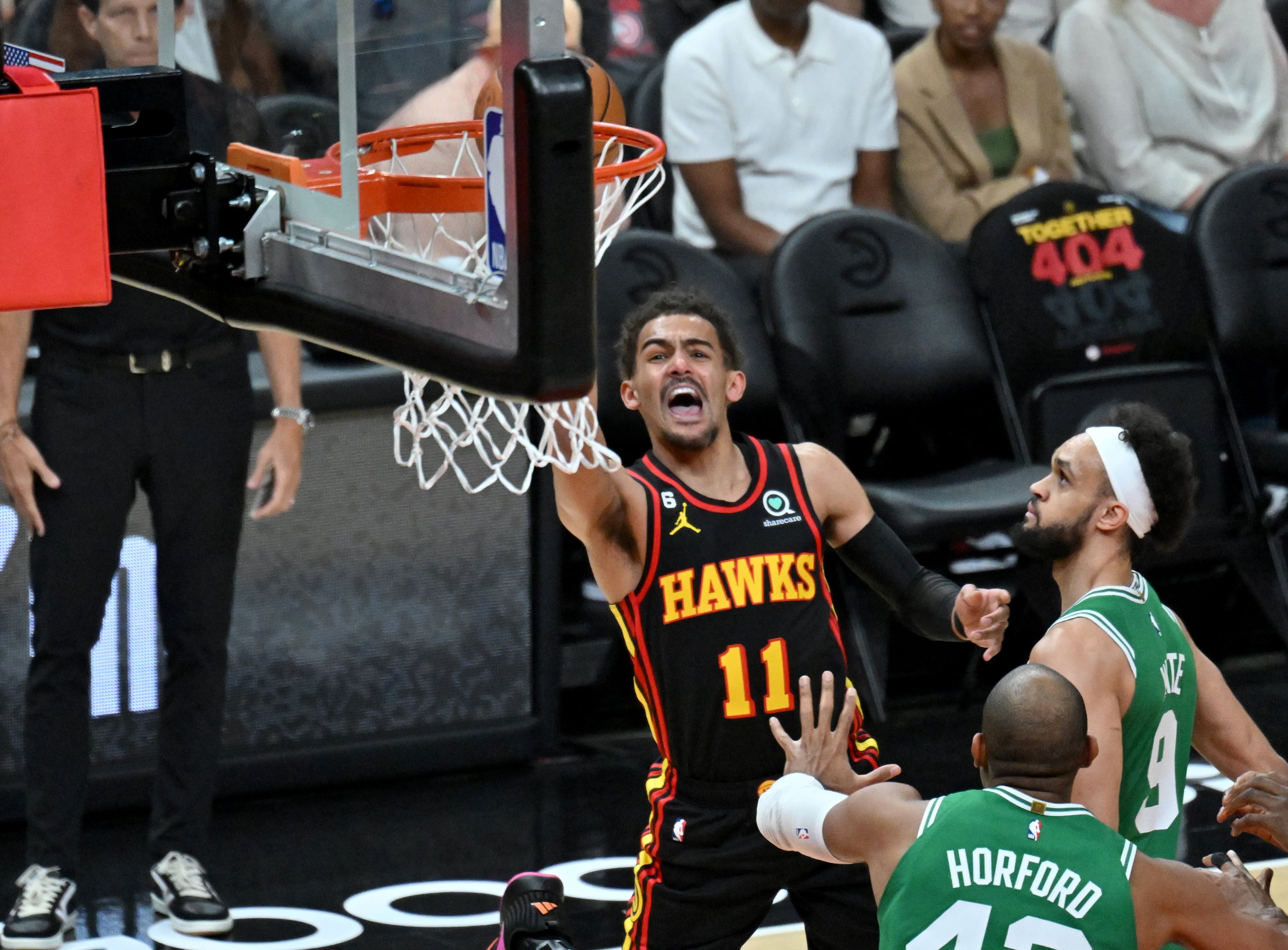 Atlanta Hawks' guard Trae Young (11) shoots over Boston Celtics' center Al Horford (42) during the first half. The Hawks won 130-122. (Hyosub Shin / Hyosub.Shin@ajc.com)
