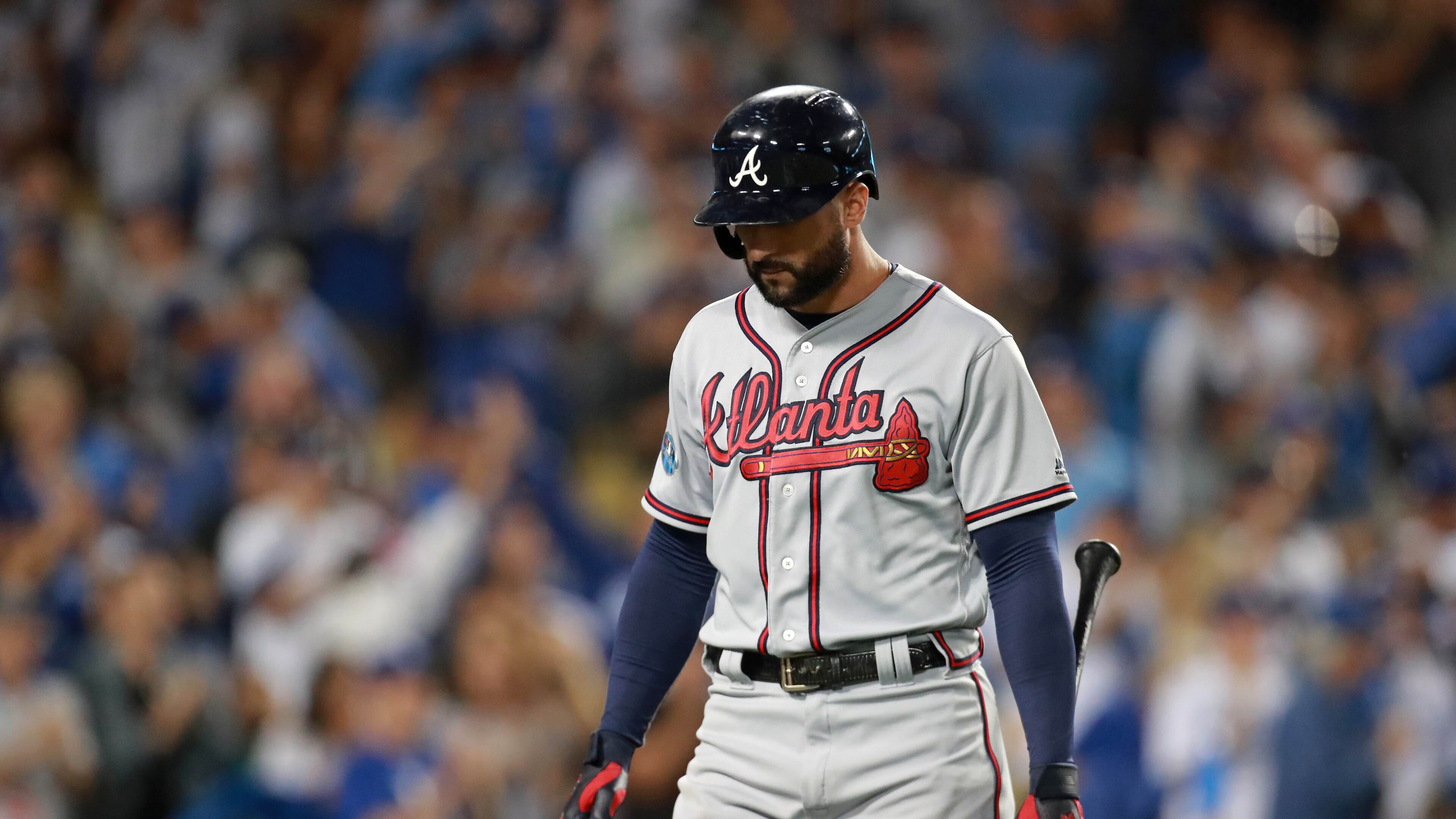 Braves right fielder Nick Markakis reacts after striking out with left fielder Ronald Acuna (not pictured) on third base in the first inning against the Los Angeles Dodgers in Game 2 of a National League Division Series baseball game Friday, October 5, 2018, in Los Angeles. The Dodgers won 3-0. Curtis Compton/ccompton@ajc.com