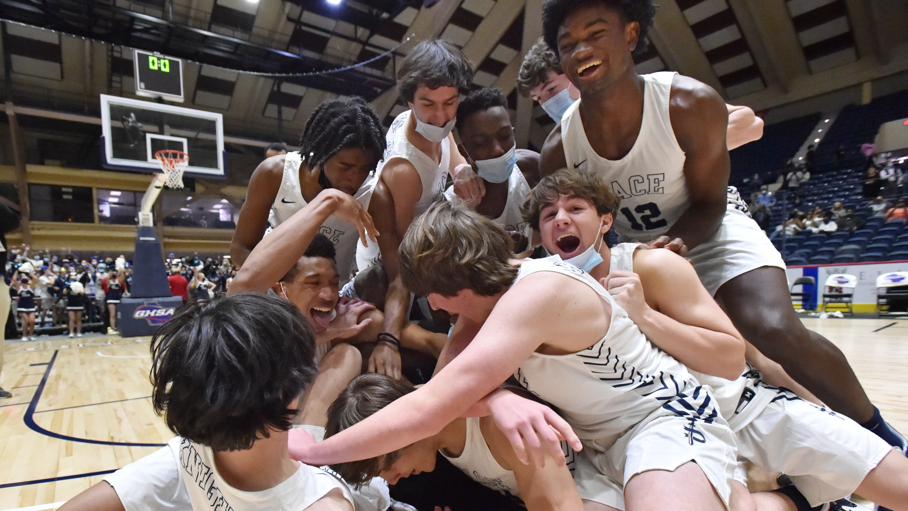 March 11, 2021 Macon - Pace Academy players celebrate their victory over Columbia during the 2021 GHSA State Basketball Class AA Boys Championship game at the Macon Centreplex in Macon on Thursday, March 11, 2021 Pace Academy won 73-42 over Columbia. (Hyosub Shin / Hyosub.Shin@ajc.com)