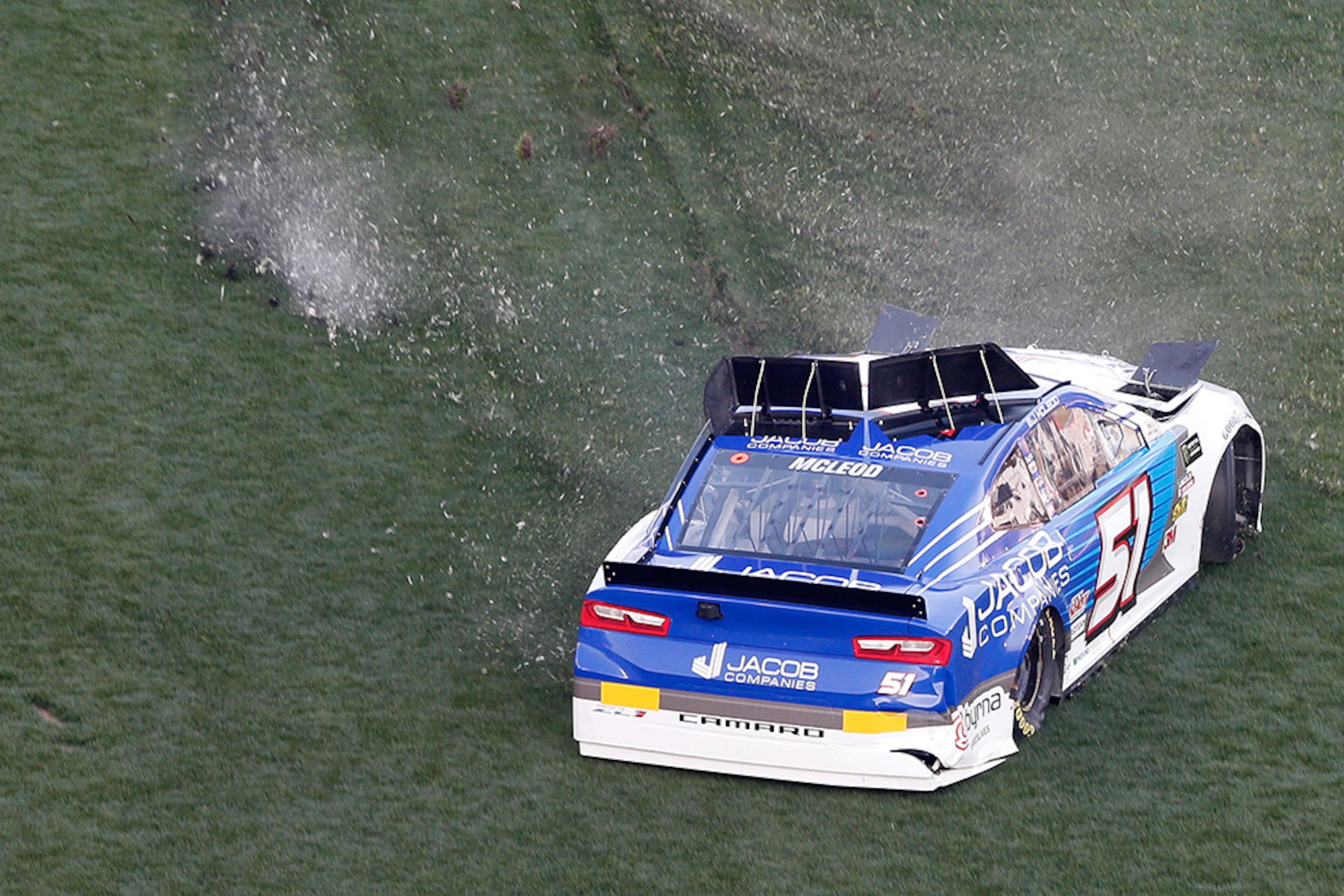 BJ McLeod (51) spins out in the infield after he was involved in an on-track incident during the Monster Energy NASCAR Cup Series 61st Annual Daytona 500 Sunday, Feb. 17, 2019, at Daytona International Speedway in Daytona Beach, Fla.